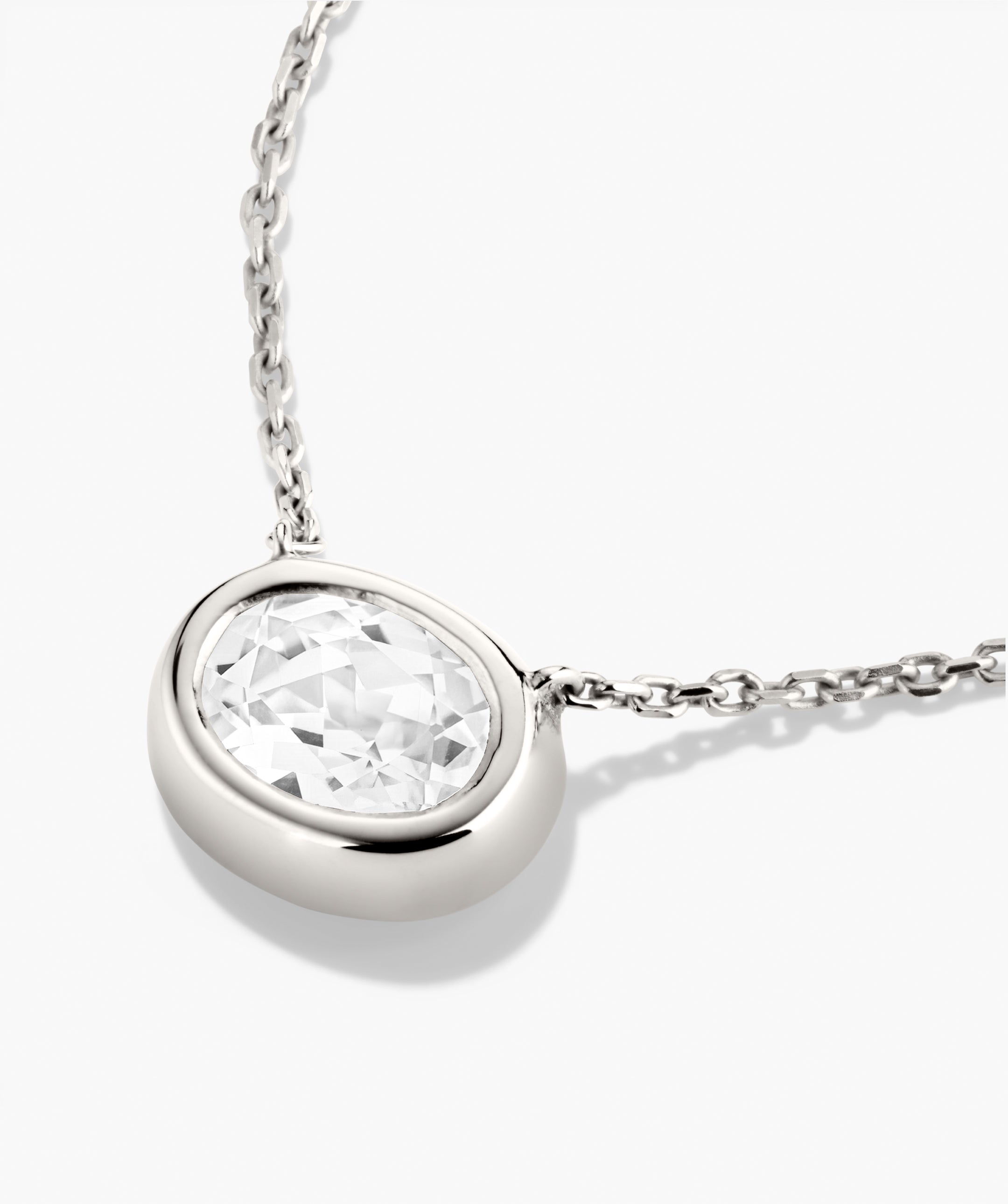 Lucia Necklace features an oval bezel-set lab-grown sapphire on a silver chain, perfect as a signature piece for any look.