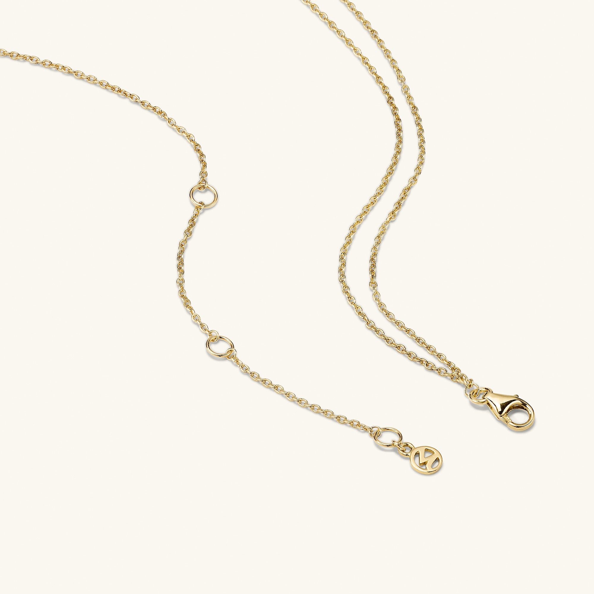 Linked Gemstone Necklace featuring two interlinked rings and a green aventurine link on a 14k gold chain with a clasp.