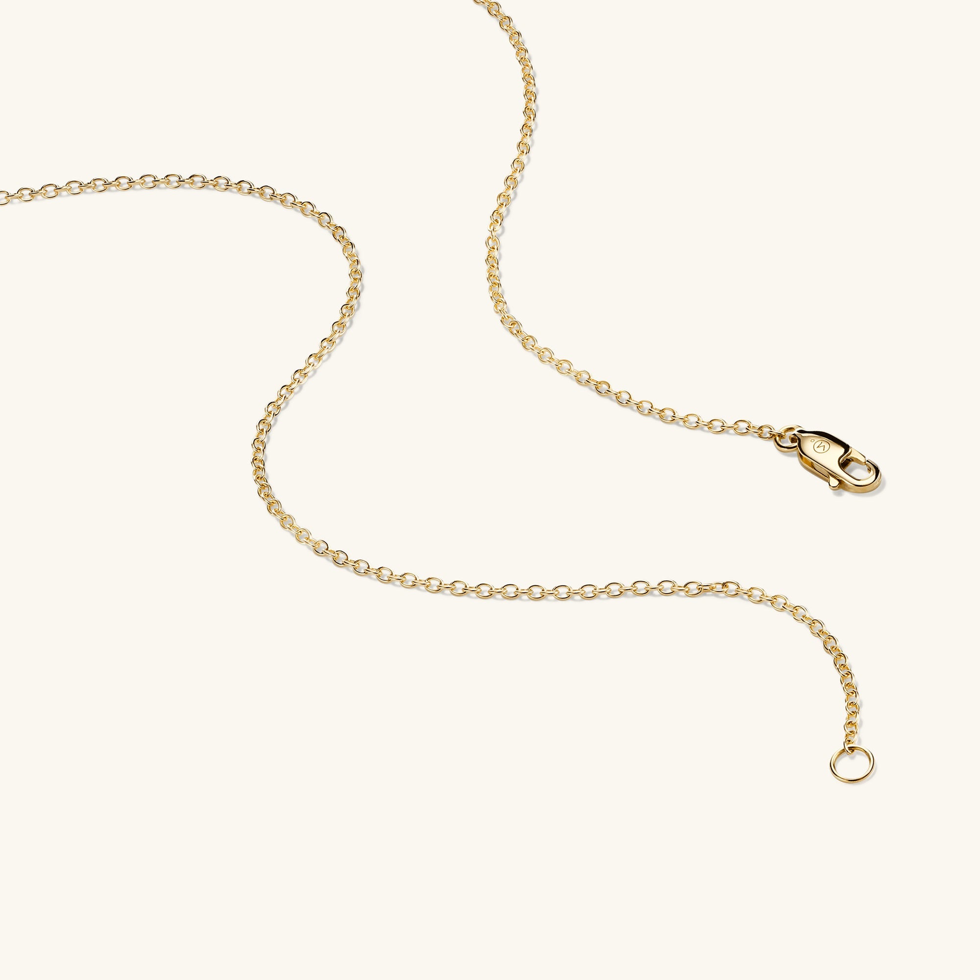 Cable Chain Necklace: A sleek gold chain featuring a clasp and fish charm, handcrafted in 14k solid yellow gold, offering timeless elegance.
