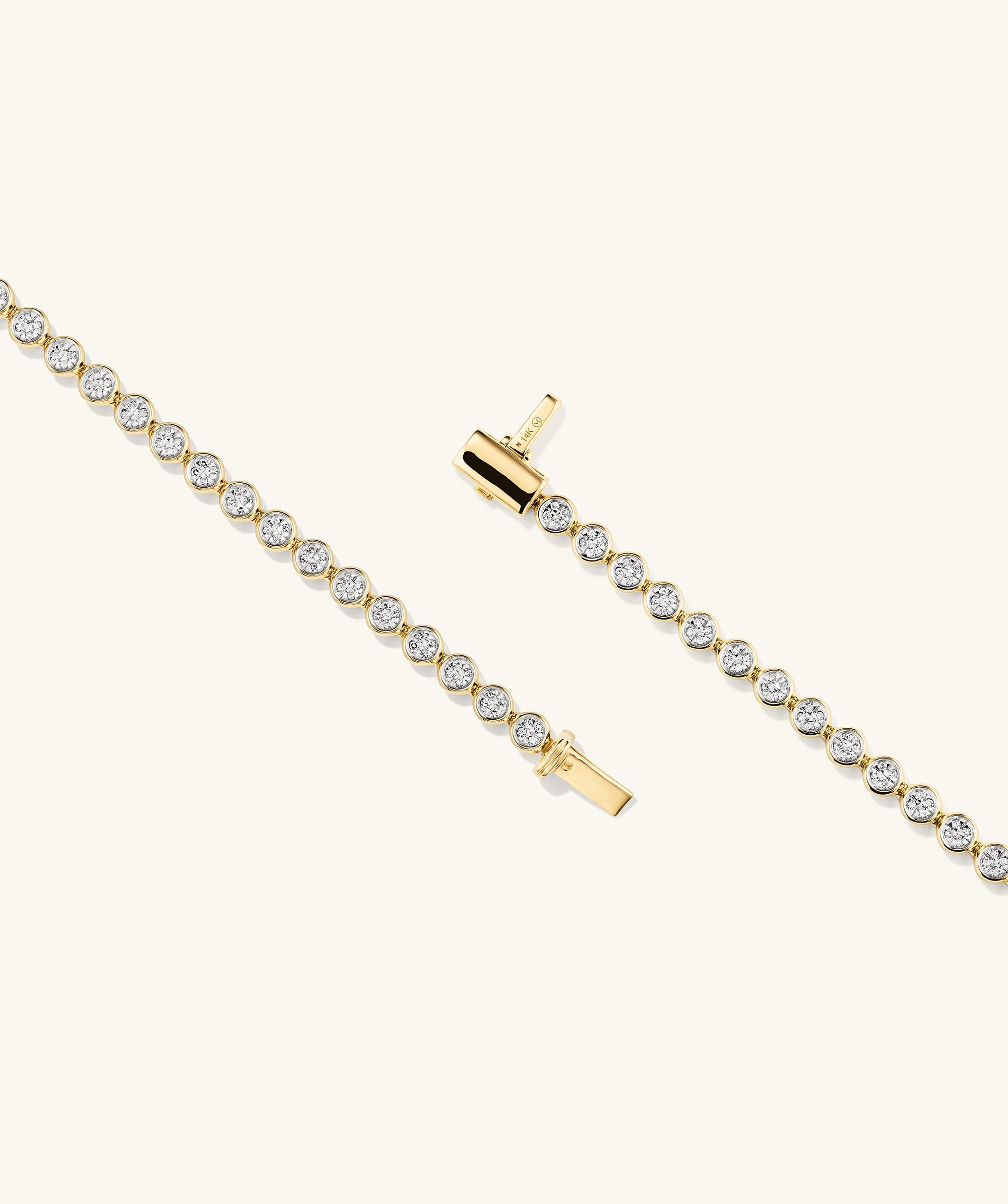 Micro-PavÃ© Diamond RiviÃ¨re Bracelet in 14k gold, featuring 176 knife edge bezel set diamonds for a continuous, luxurious shine.