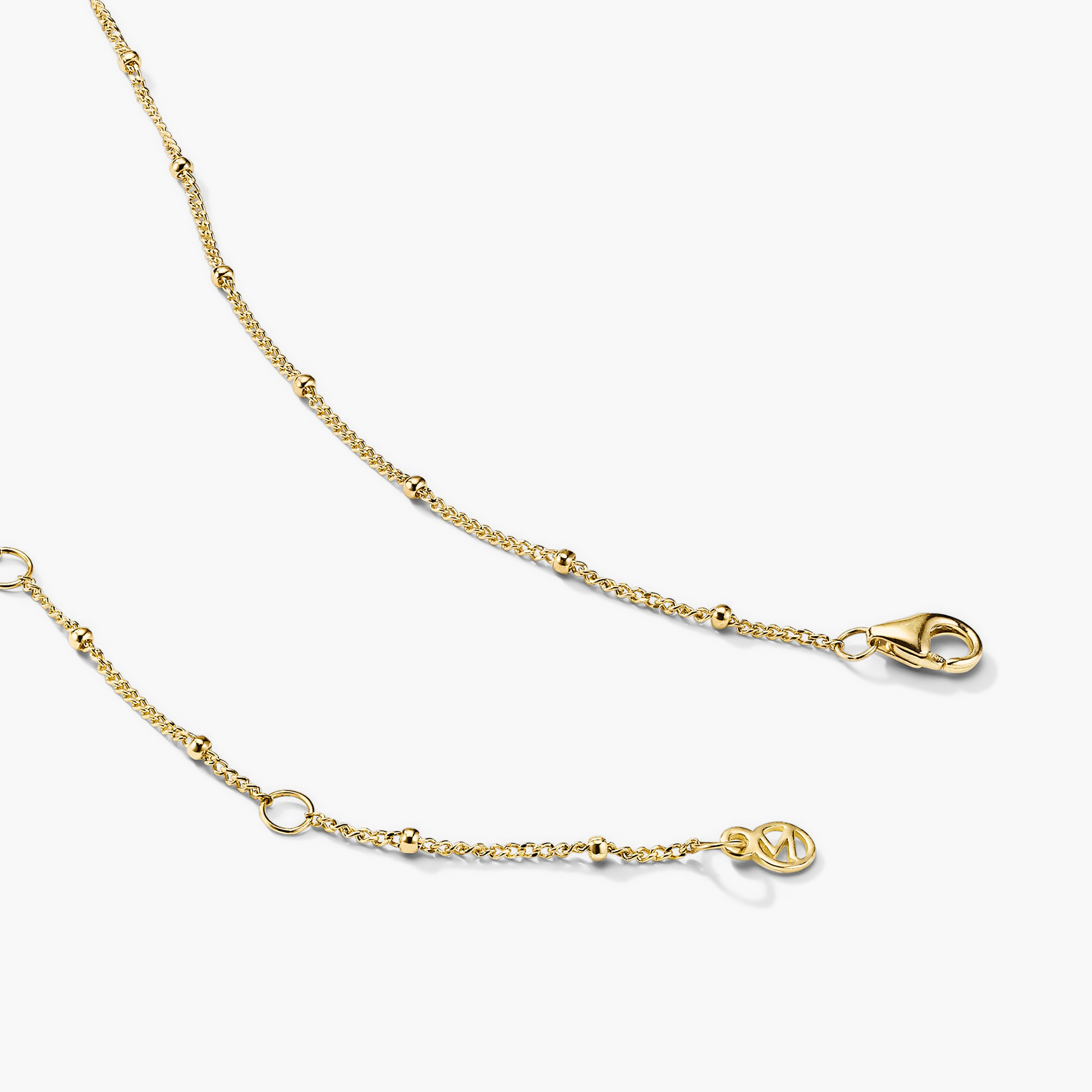 Spheres Chain Necklace: A minimalistic gold chain featuring a clasp, perfect for versatile wear on any occasion.