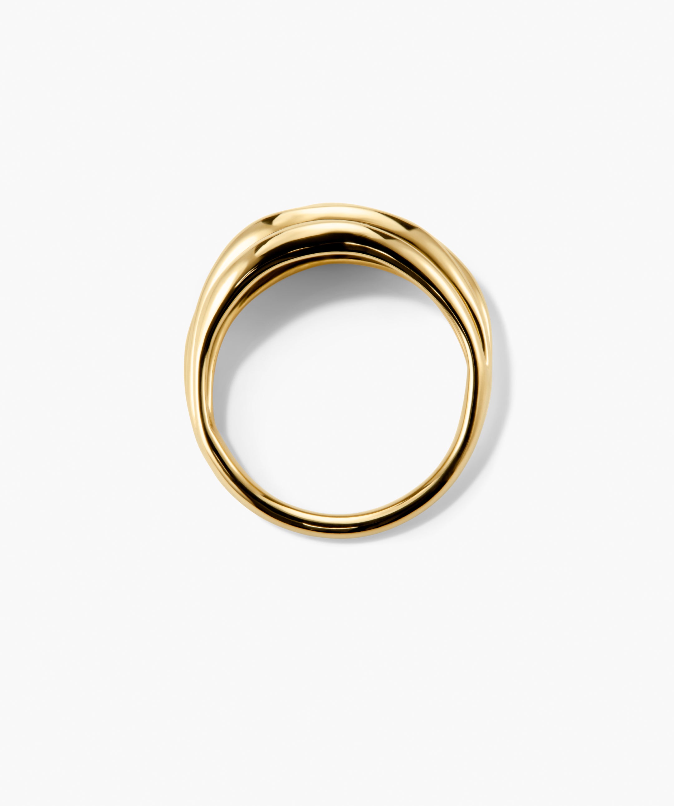 Bold Open DÃ´me Ring: A twisted gold hoop with open spaces and asymmetrical design, showcasing subtle texture for a modern statement piece.