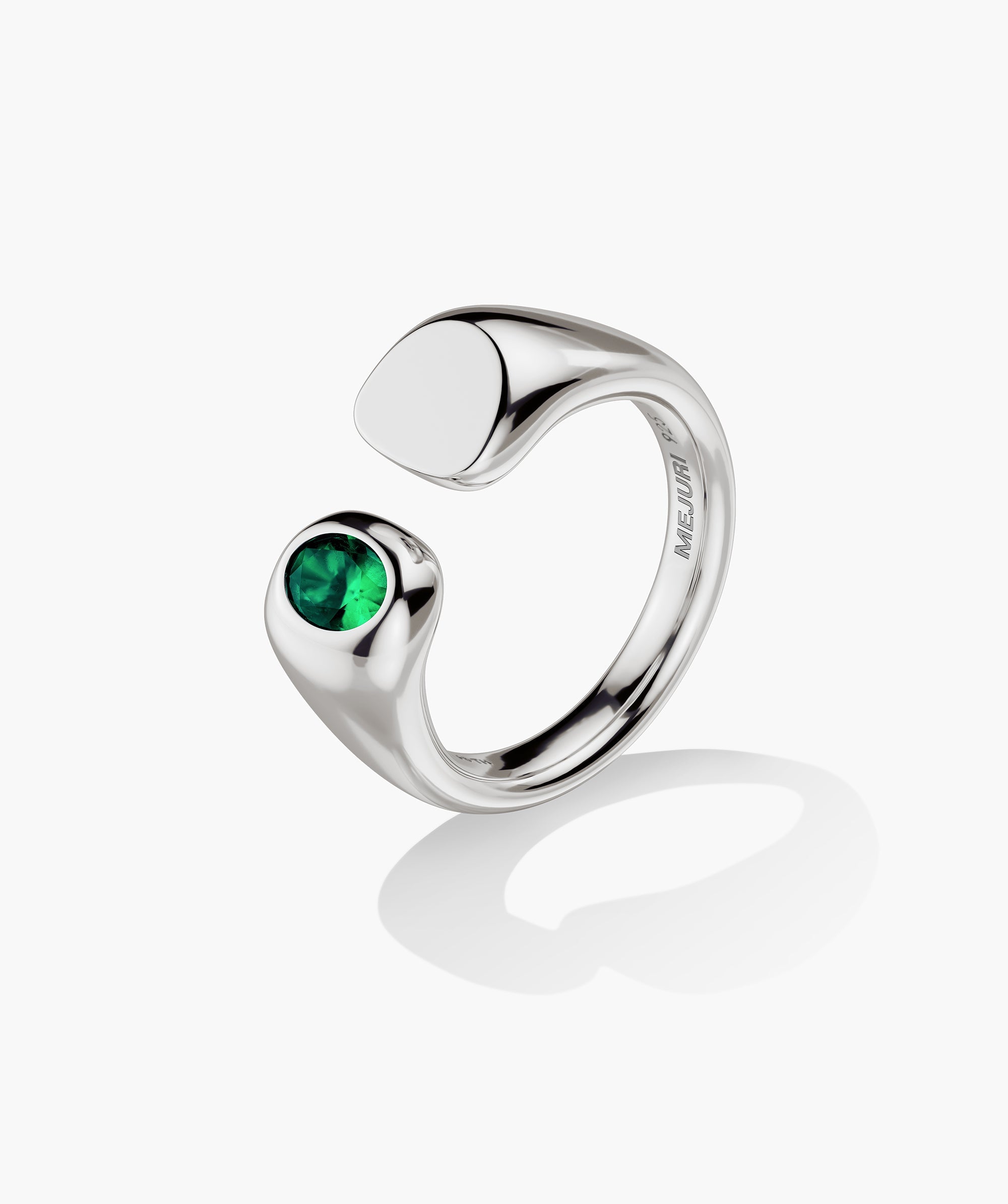 Noa Open Signet Pinky Ring: Sterling silver ring with a polished pad and bezel-set green gemstone, featuring an open design and 925 stamp inside the band.