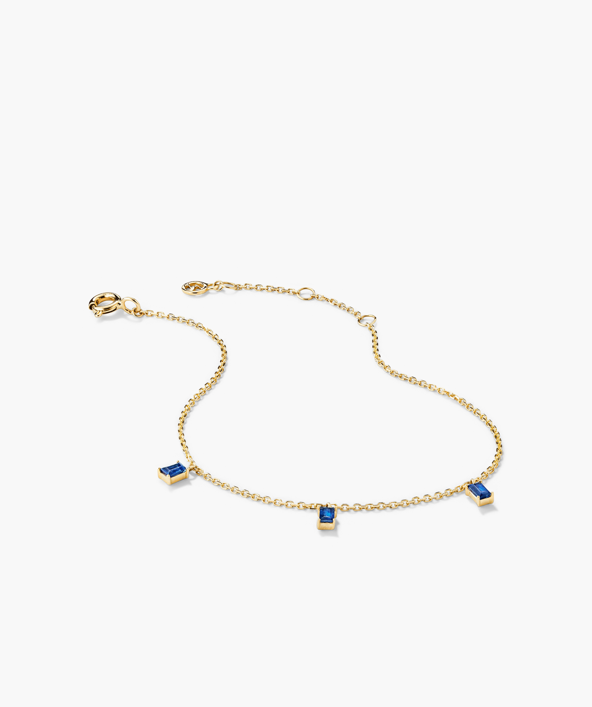 Baguette Gemstone Bracelet featuring a gold chain with blue stones and diamonds, perfect for creating standout stacks.