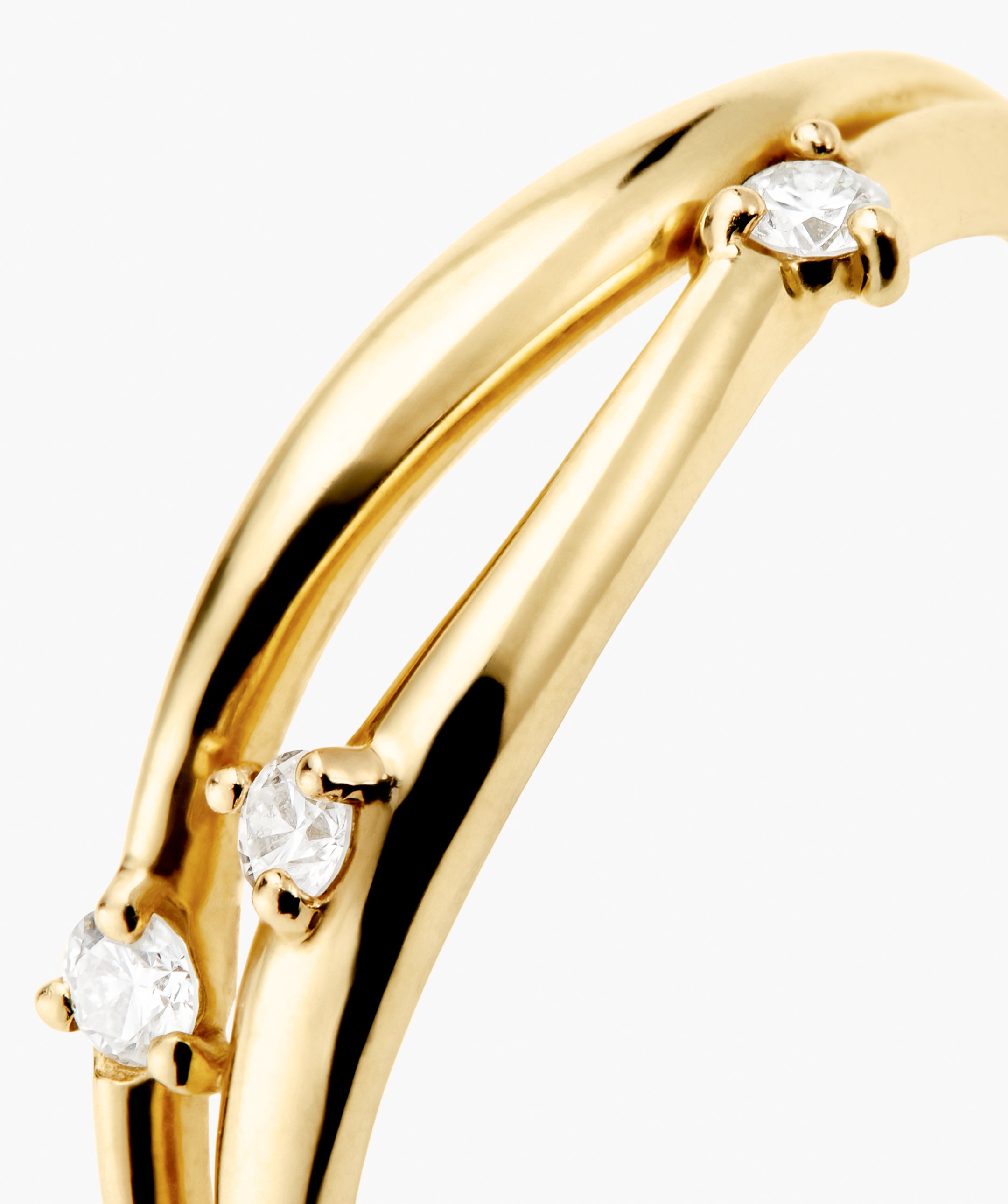 Open DÃ´me Diamond Ring close-up showcasing three small round diamonds in four-prong settings on a split-shank band, crafted from responsibly sourced 14k Salmon Gold.