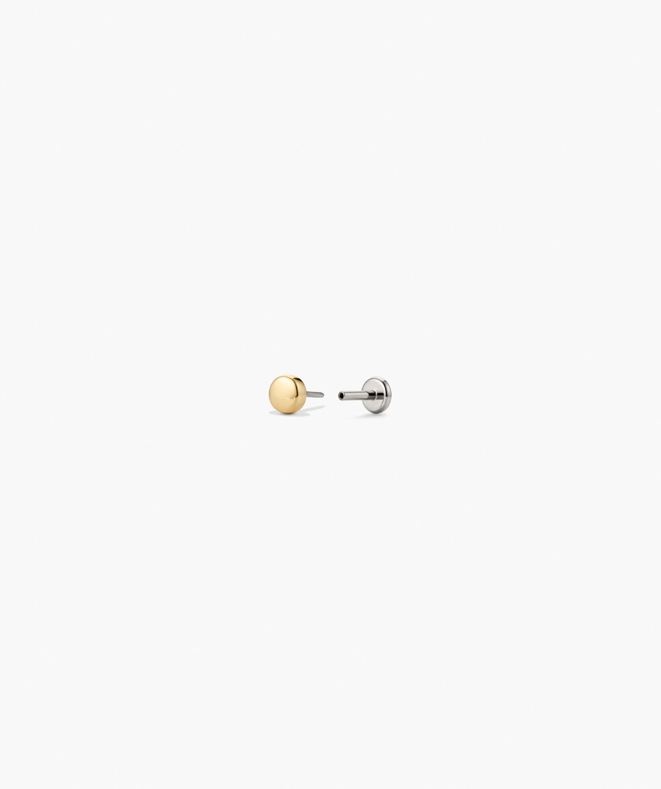 Mini Thumbtack Flat Back Stud features a gold-tone dot front and a titanium post with flat backing, offering minimalist design and comfortable wear.