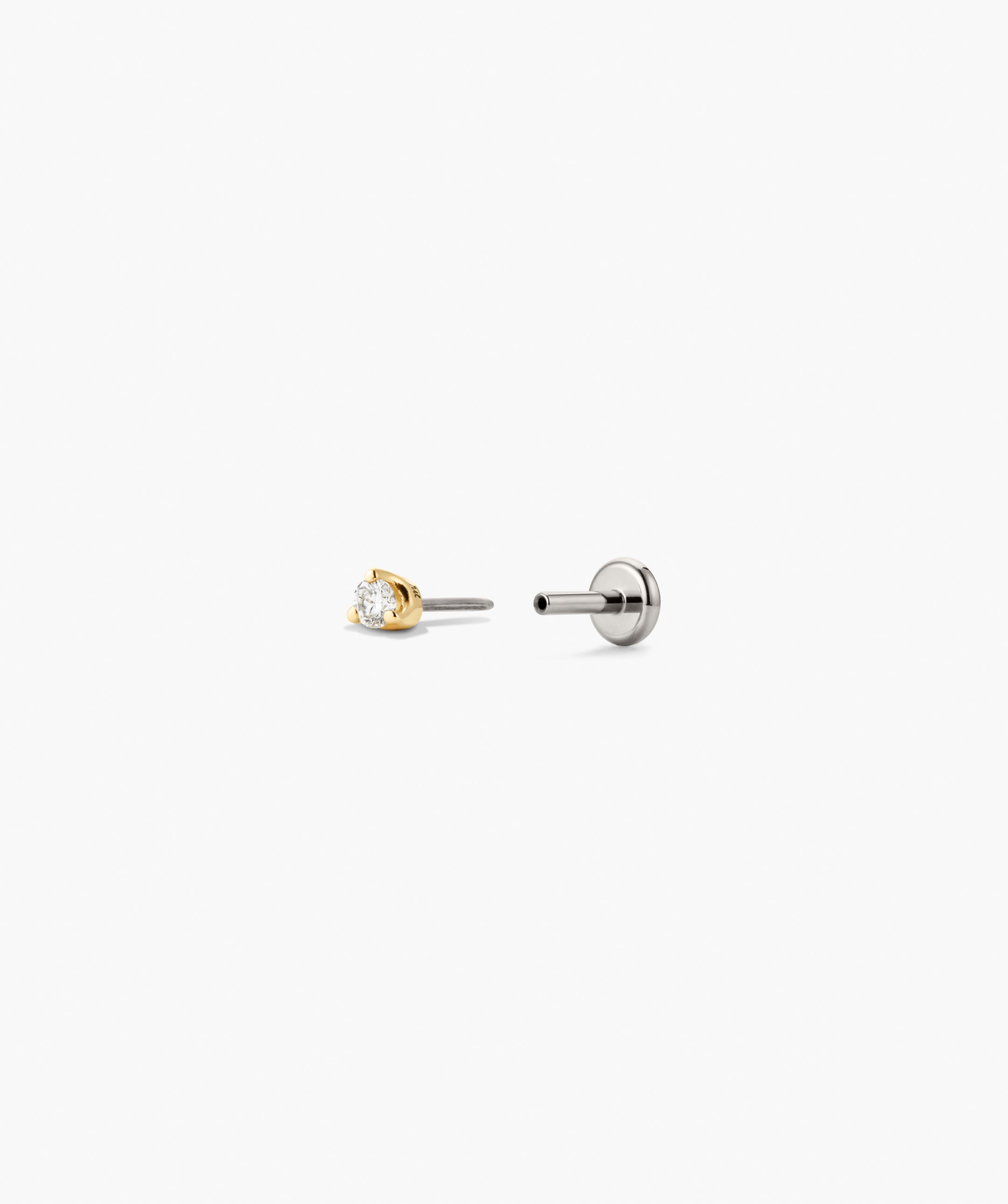 Piercing Studio - Baby Diamond Stud features a brilliant-cut diamond in a three-prong setting with a matching disc-style fastener for secure wear.