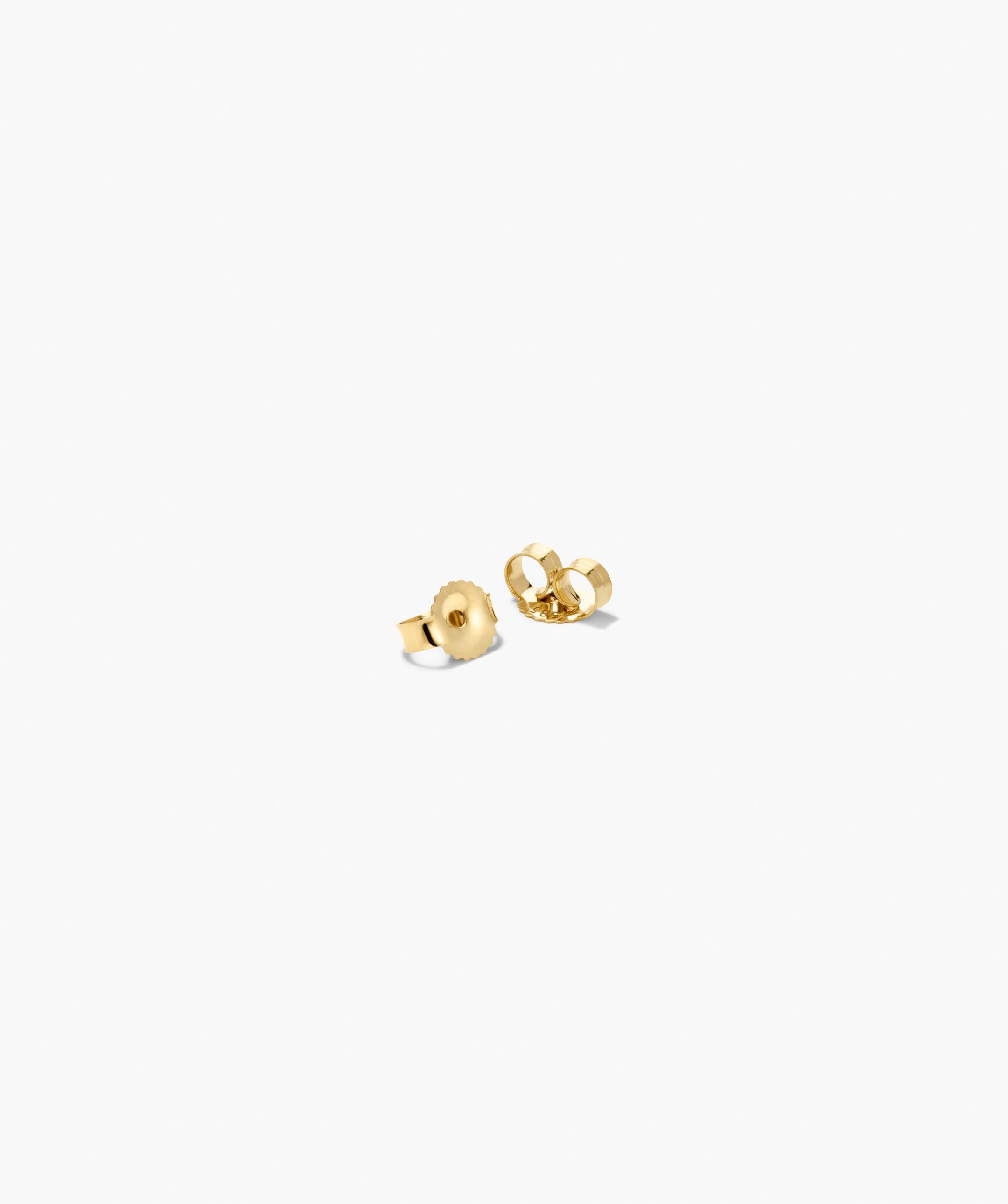 Lab Grown Diamond Petal Drops featuring two small gold-tone earring backs, designed for secure wear of triple-diamond studs, offering a soft statement with edge.