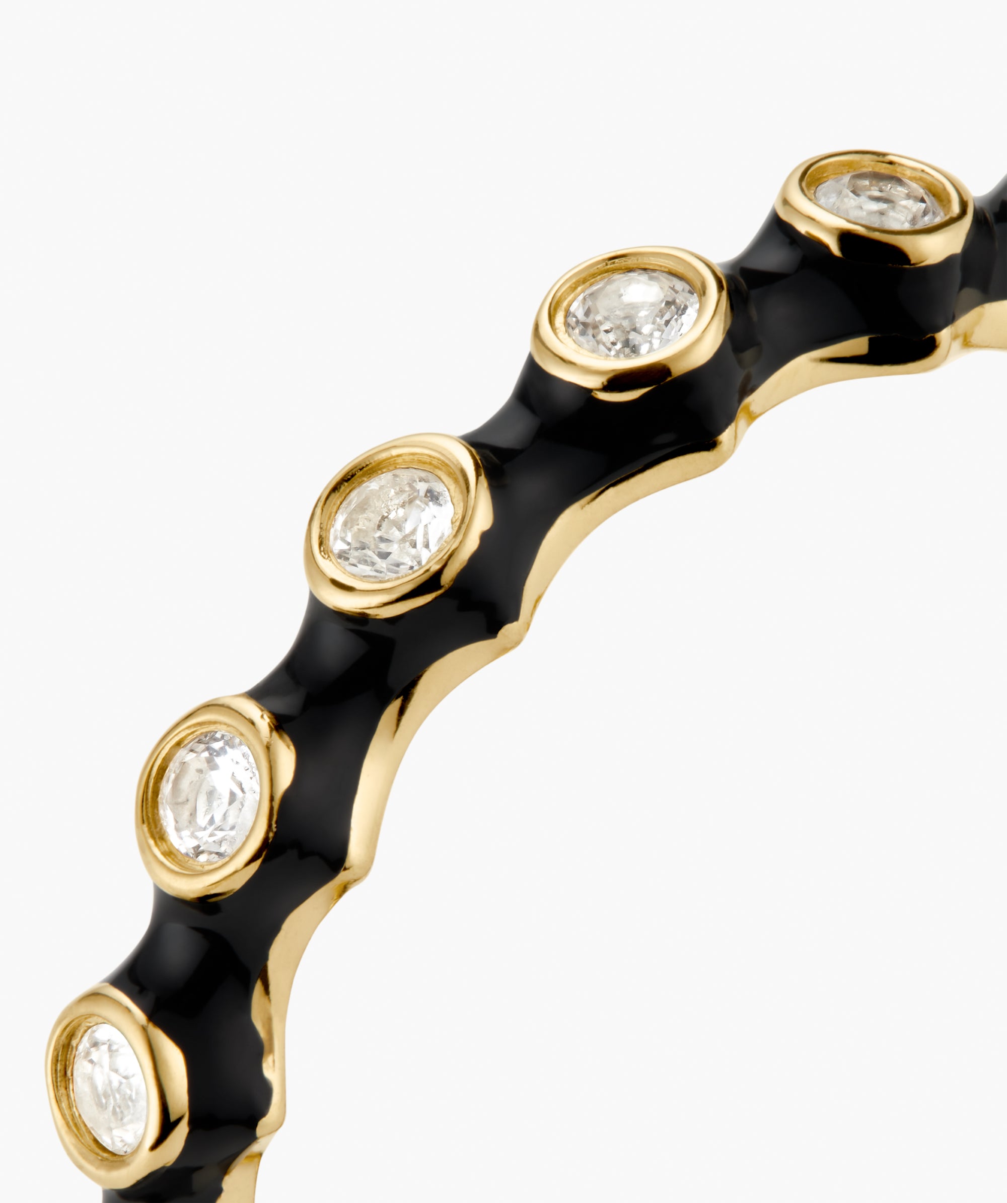 Enamel Charlotte Stacker Ring: A gold bangle with glossy black enamel, adorned with bezel-set diamonds for a crisp, stackable look.