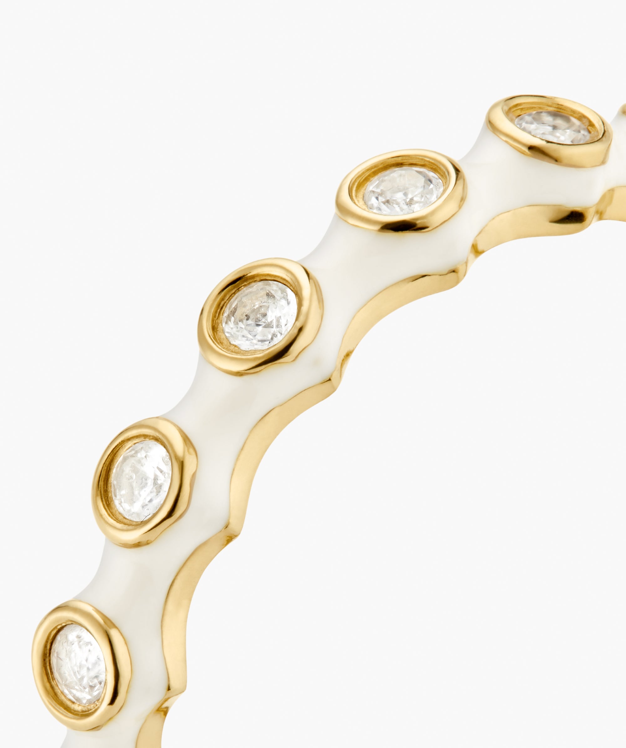 Enamel Charlotte Stacker Ring: Close-up of a white enamel band edged in yellow gold, featuring bezel-mounted lab-grown sapphires, showcasing its crisp and stackable design.