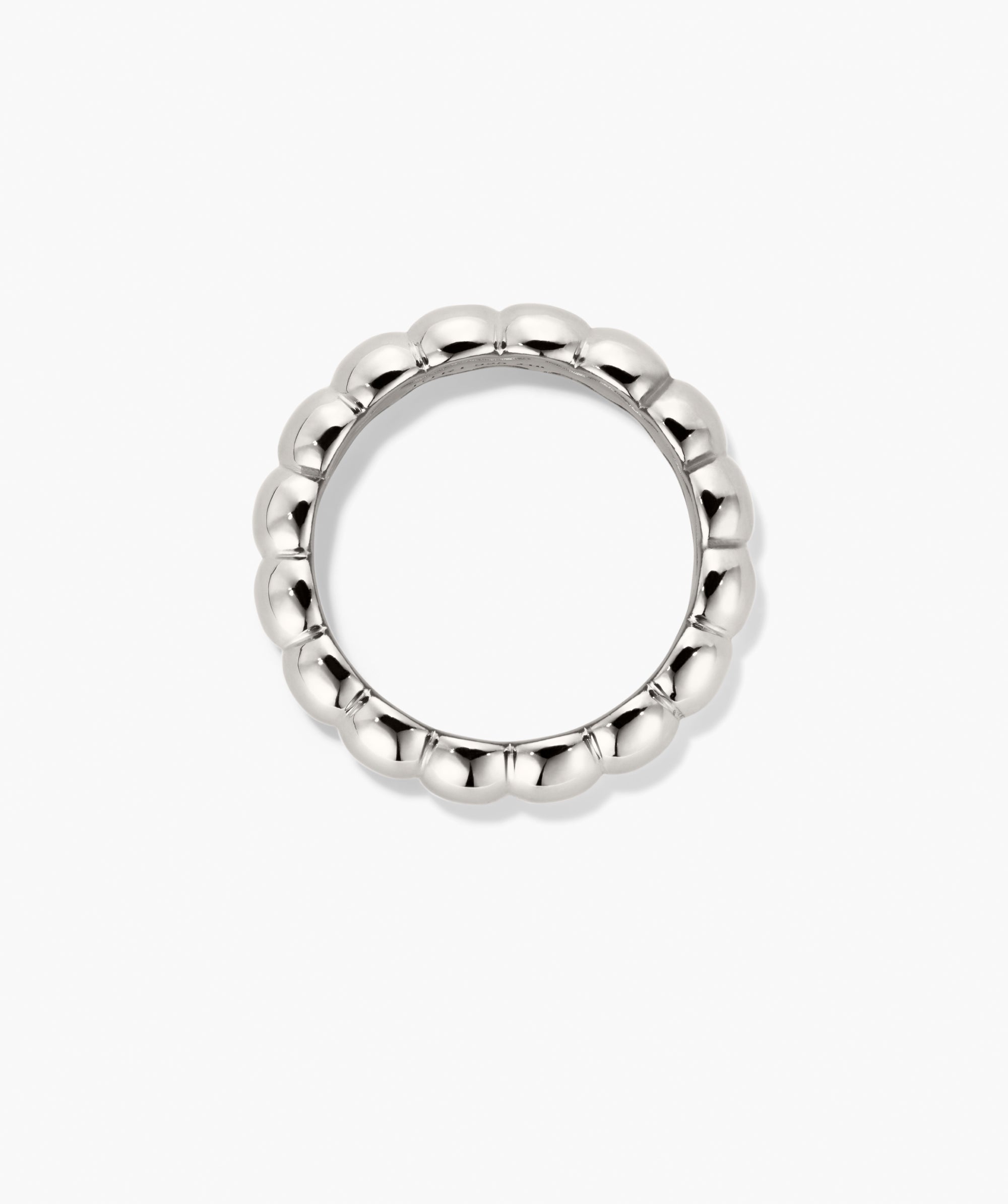Puffy Charlotte Stacker Ring: A polished silver band with a continuous loop of small, rounded beads, offering soft curves and bold shine.