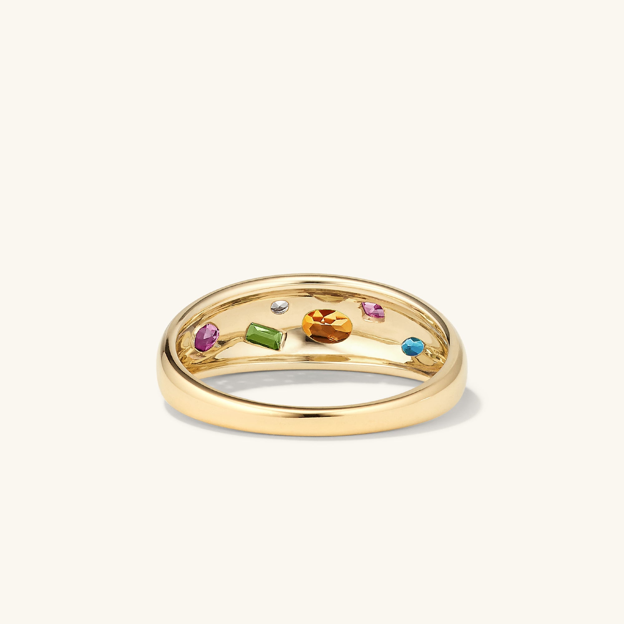 Toronto Mosaic DÃ´me Ring: A gold ring featuring six gemstones in varied cuts, including rhodolite, green tourmaline, and blue topaz, inspired by mosaic art.