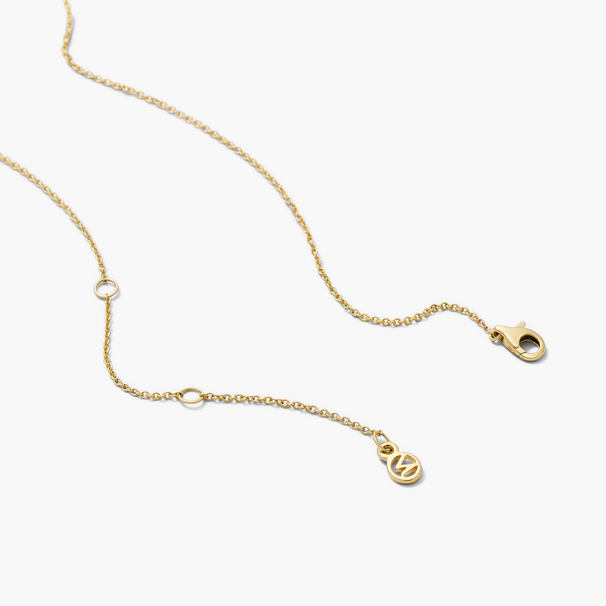 Zodiac Pendant Necklace with a gold chain and constellation-themed spinning disk set with white sapphire gemstones.