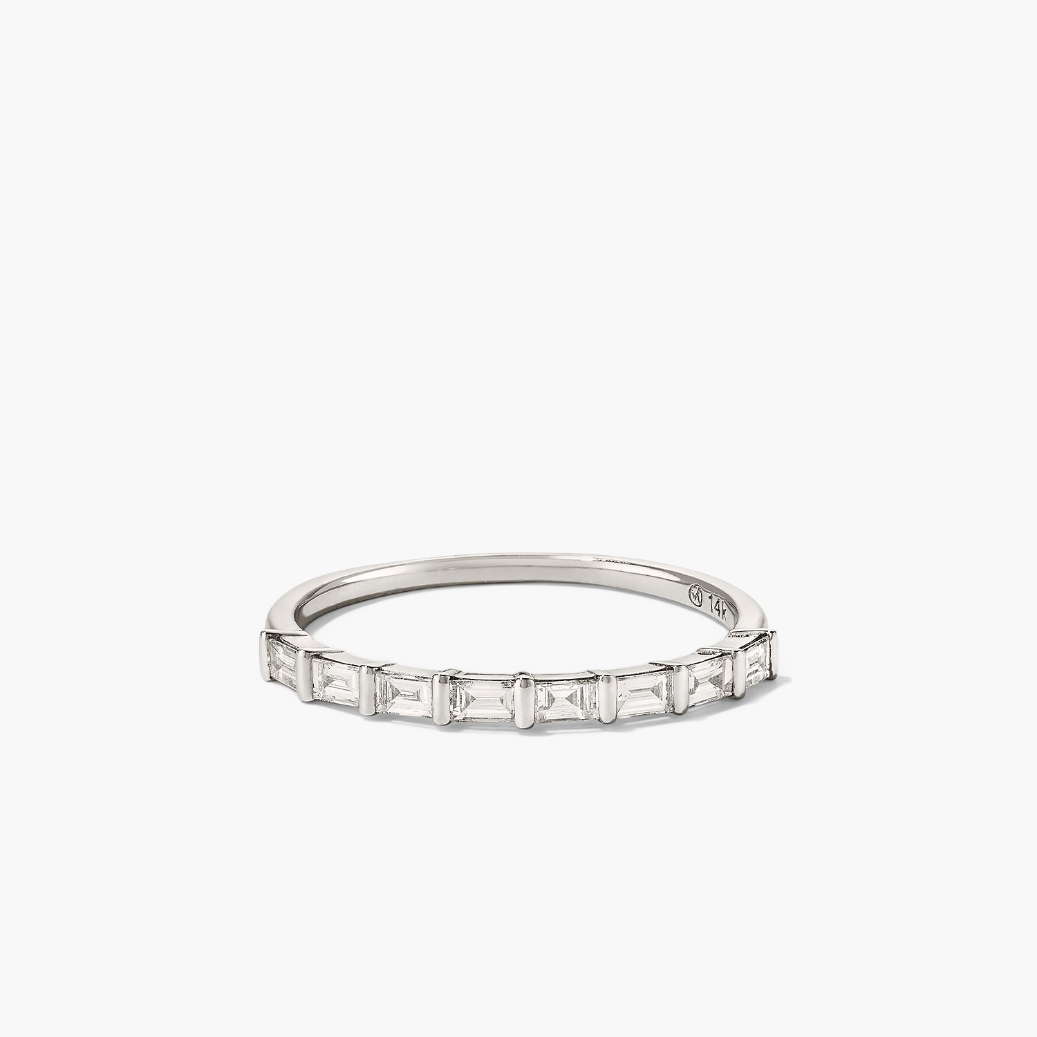Silver ring with eight baguette diamonds set in a timeless band, known as the Baguette Diamond Half Eternity Band.