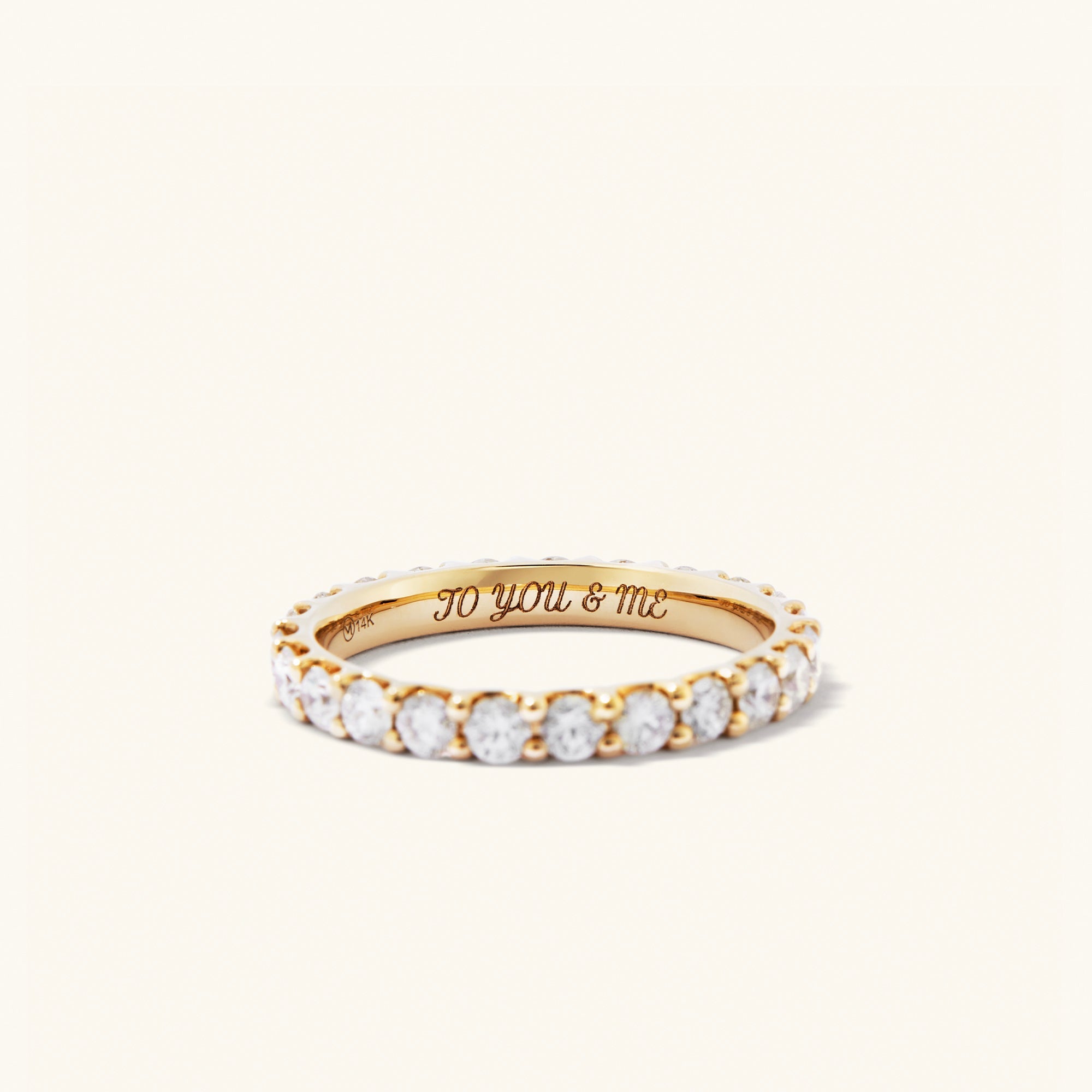 Bold Diamond Eternity Ring: 14k gold ring adorned with 23 round brilliant cut diamonds set in open prong baskets for enhanced sparkle.