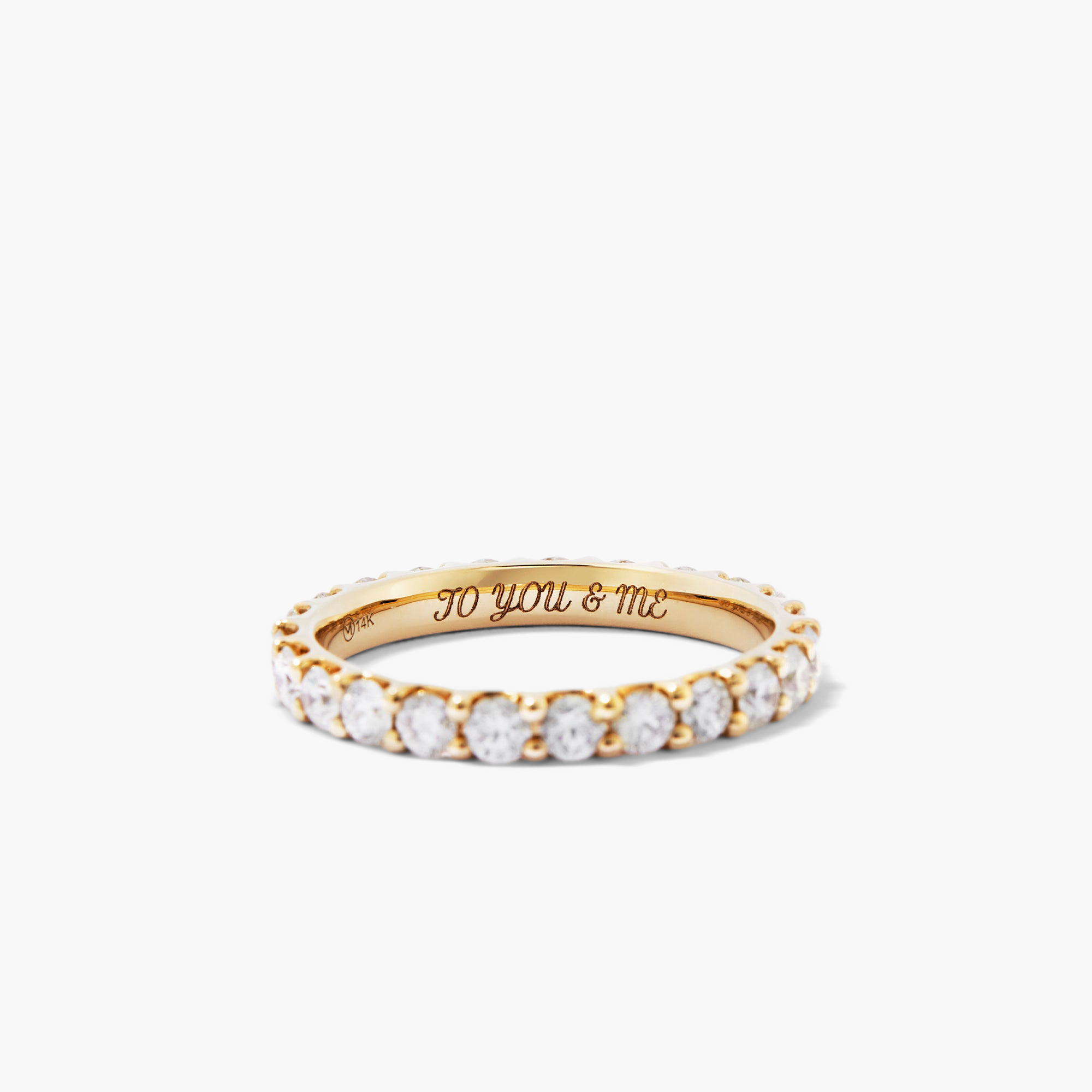 Bold Diamond Eternity Ring: 14k gold ring adorned with 23 round brilliant cut diamonds set in open prong baskets for enhanced sparkle.