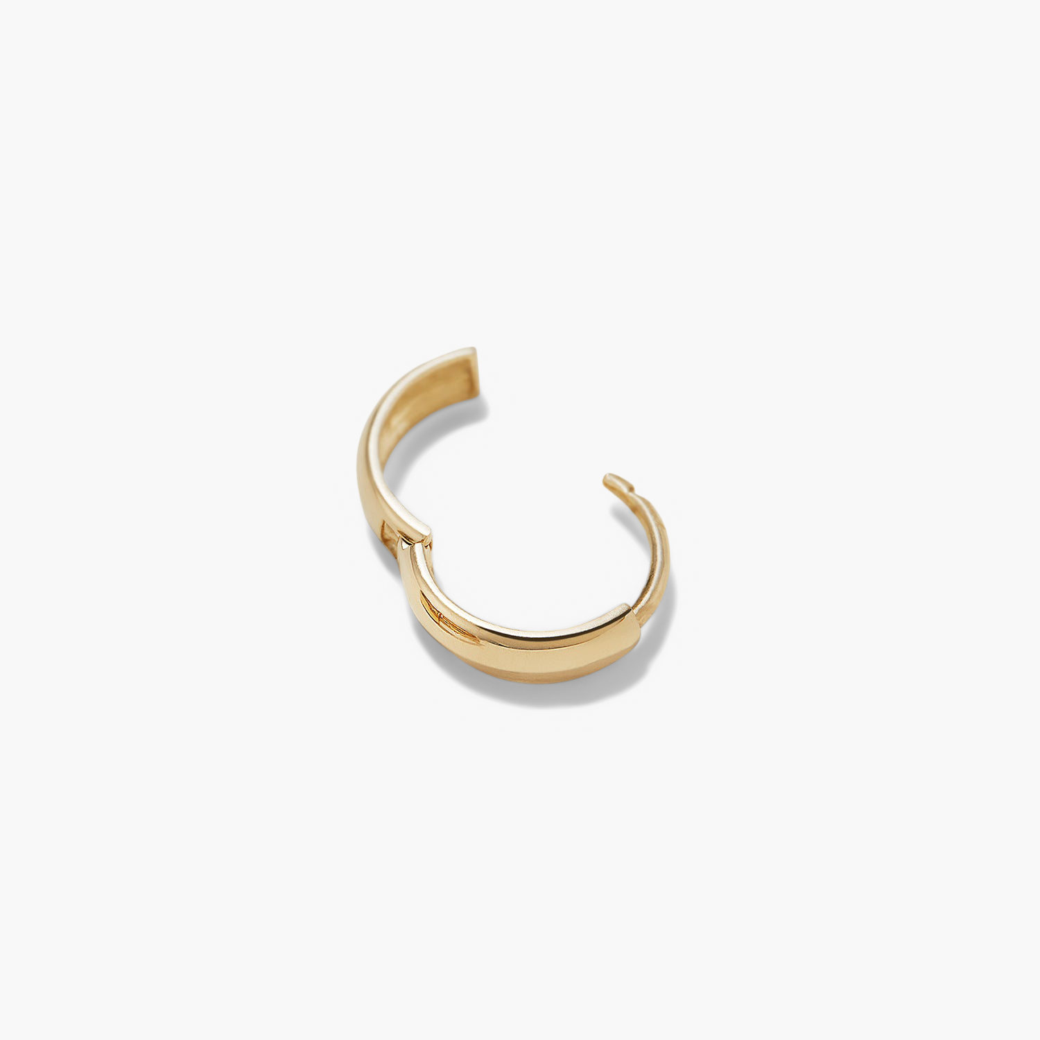 Single Bold Huggie Hoop: A handcrafted 14k solid gold hoop earring with a smooth, curved design, perfect for elevating any outfit.
