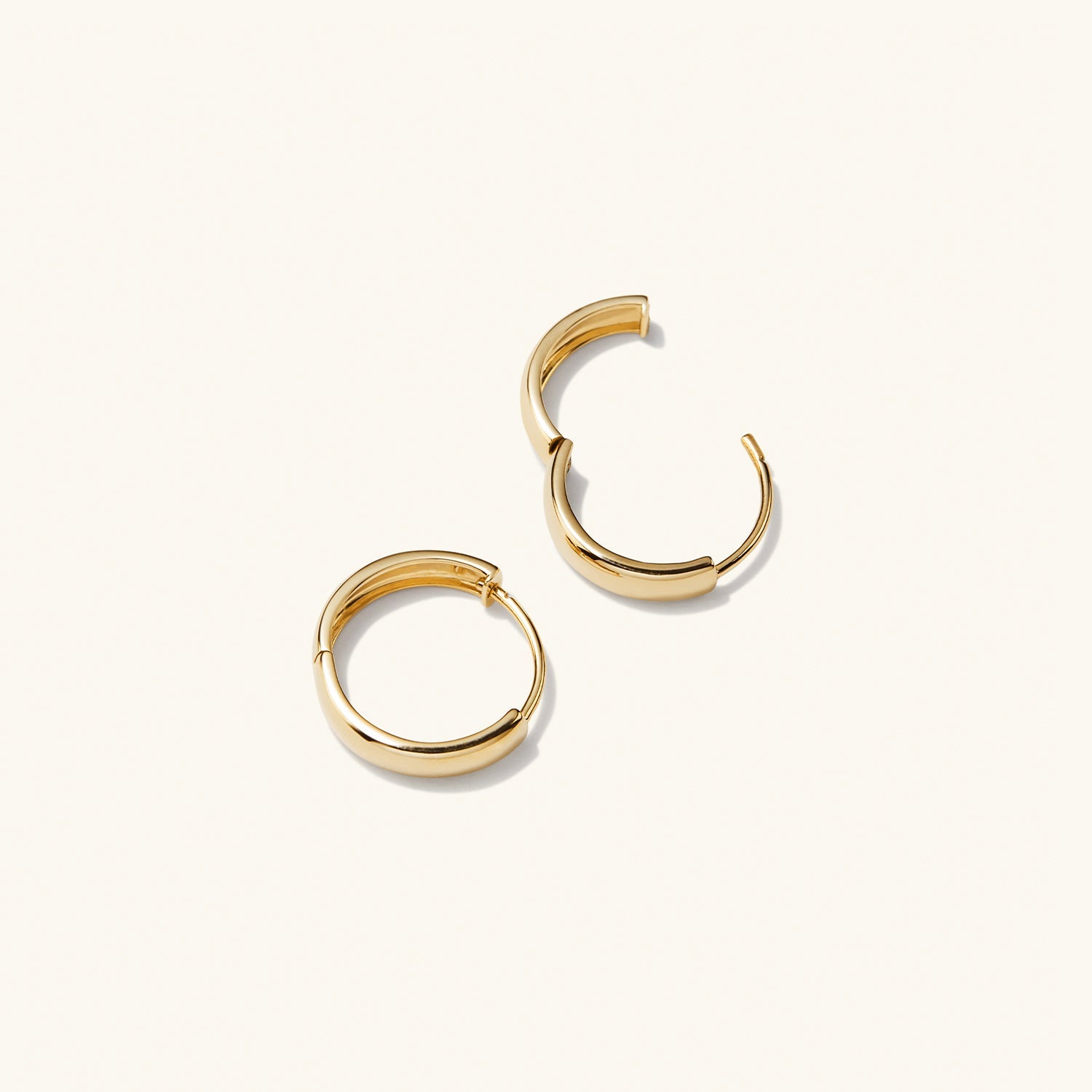 Bold Small Hoops: A pair of gold hoop earrings, perfect for elevating any outfit with their sleek, timeless design.