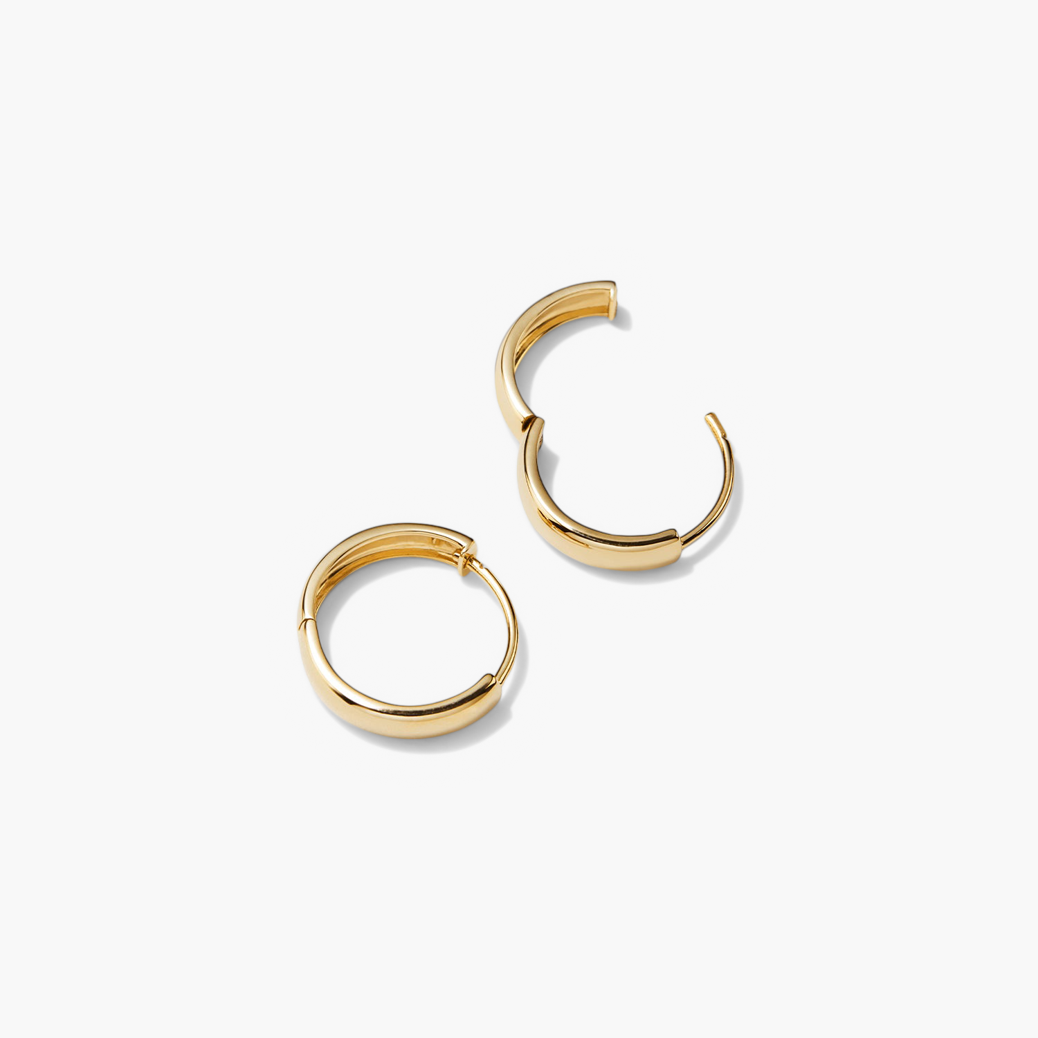 Bold Small Hoops: A pair of gold hoop earrings, perfect for elevating any outfit with their sleek, timeless design.