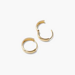 Bold Small Hoops: A pair of gold hoop earrings, perfect for elevating any outfit with their sleek, timeless design.