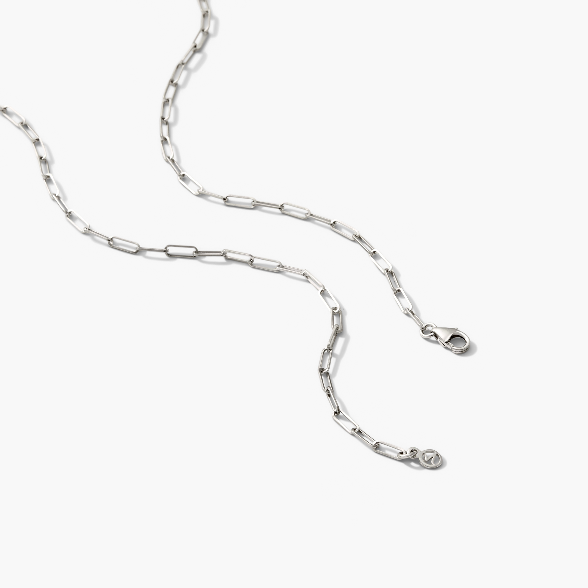 Boyfriend Bold Chain Necklace featuring a silver chain with a heart pendant, displayed on a white surface.