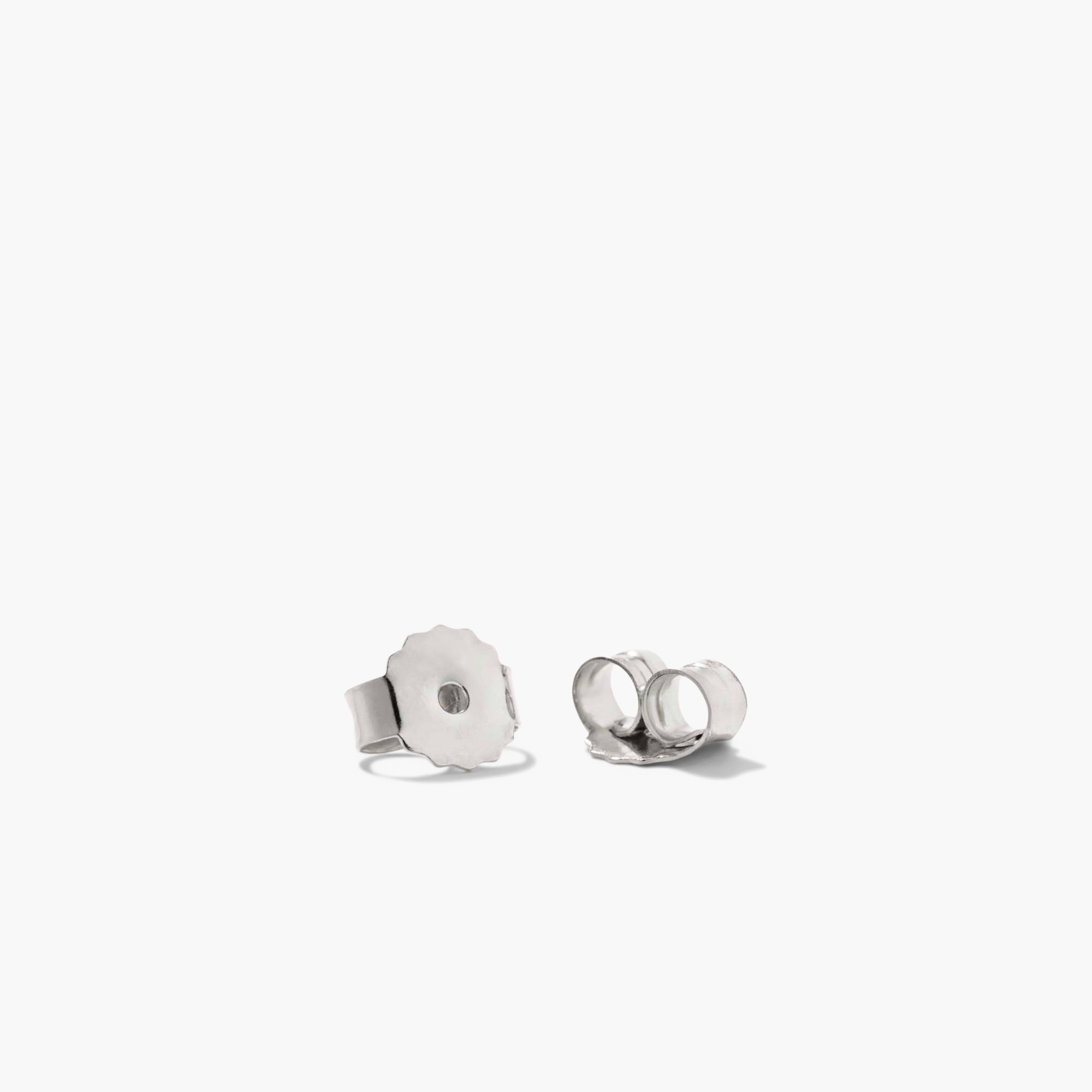 DÃ´me Huggies: A pair of silver, lobe-hugging, sculptural earrings from Mejuri's iconic collection, featuring a sleek, rounded design perfect for stacking and everyday wear.