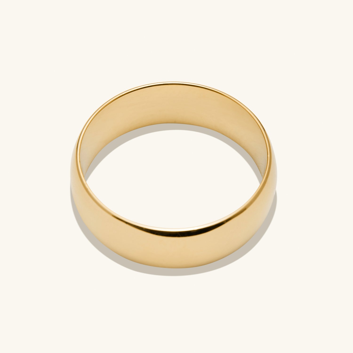 6mm Curve Band: A sleek, gold ring, perfect for marking a new chapter with its lightweight and durable design, shown on a white background.