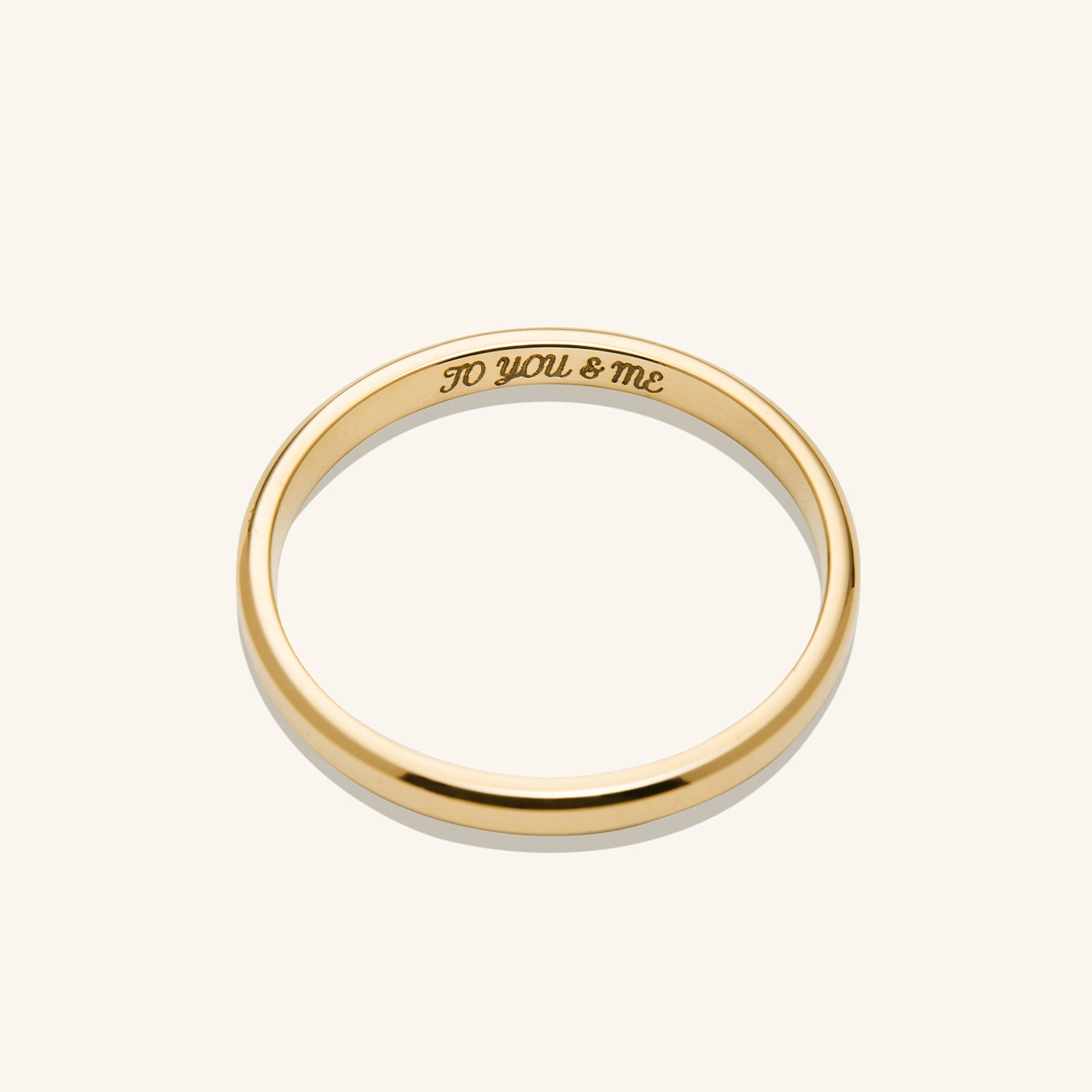 2mm Smooth Band: A handcrafted, engraved 14k gold ring with streamlined edges, symbolizing an unbreakable bond. Ideal for stacking or as a standalone piece.
