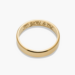 Gold ring with engraved text, titled 4mm Smooth Band, lightweight and durable, perfect for marking significant life milestones.