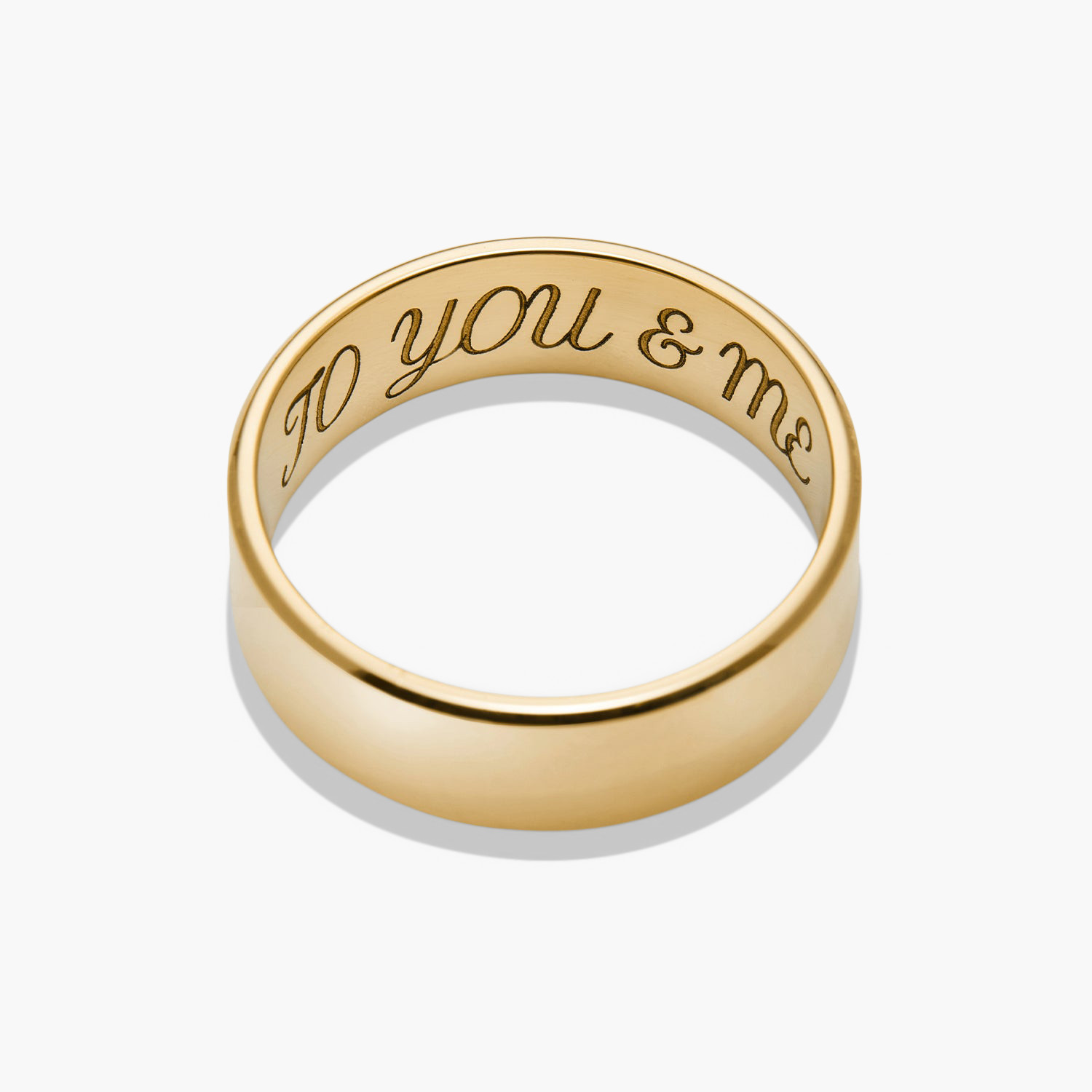 6mm Smooth Band: A gold ring with engraved words, offering a lightweight and lasting design, perfect for marking significant moments.