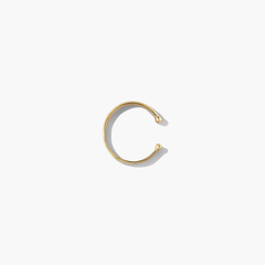 Daily Ear Cuff in vermeil, showcasing a sleek, polished design, perfect as an essential accessory with high-impact shine for versatile styling.