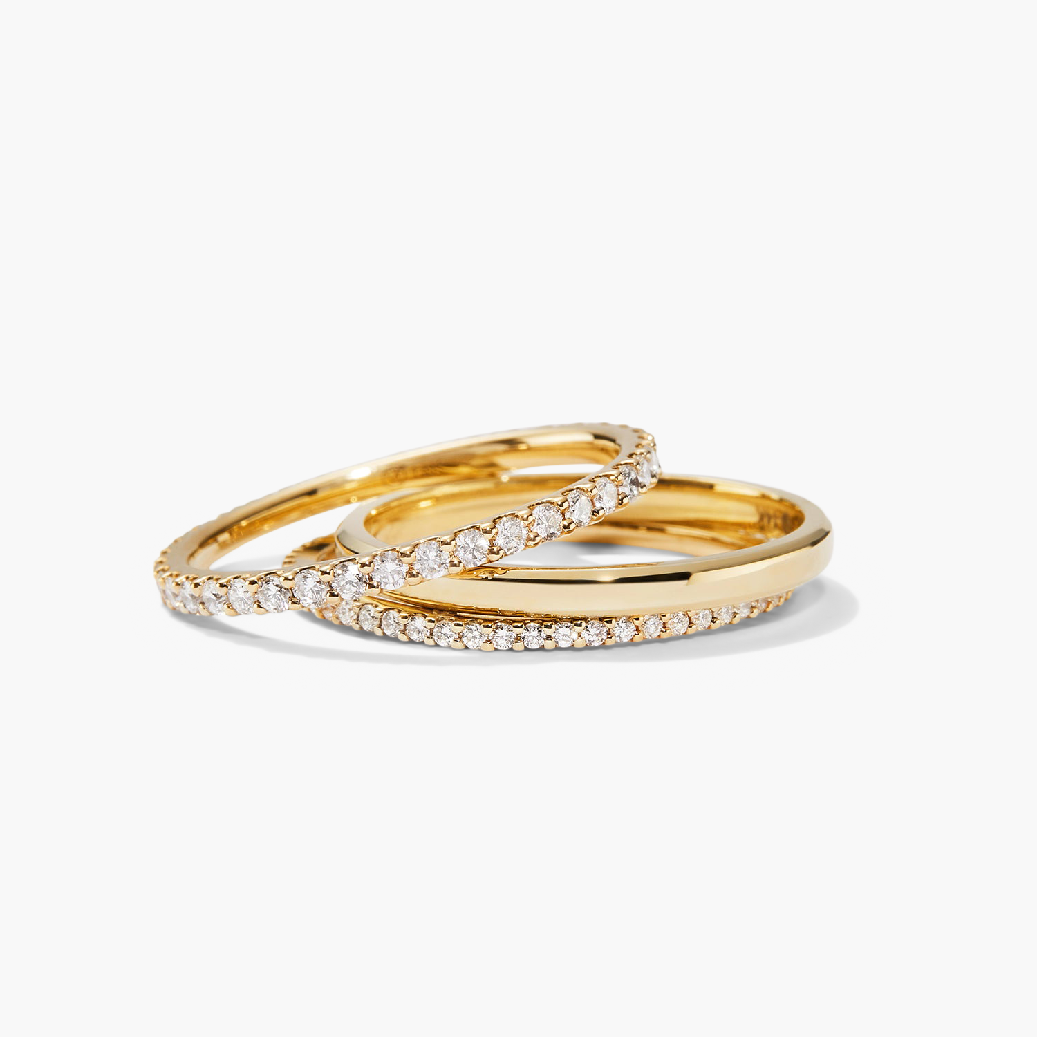 Diamond Eternity Band featuring a pair of slim, handcrafted rings in 14k gold with hand-set diamonds, enhancing their sparkle in an open prong design.