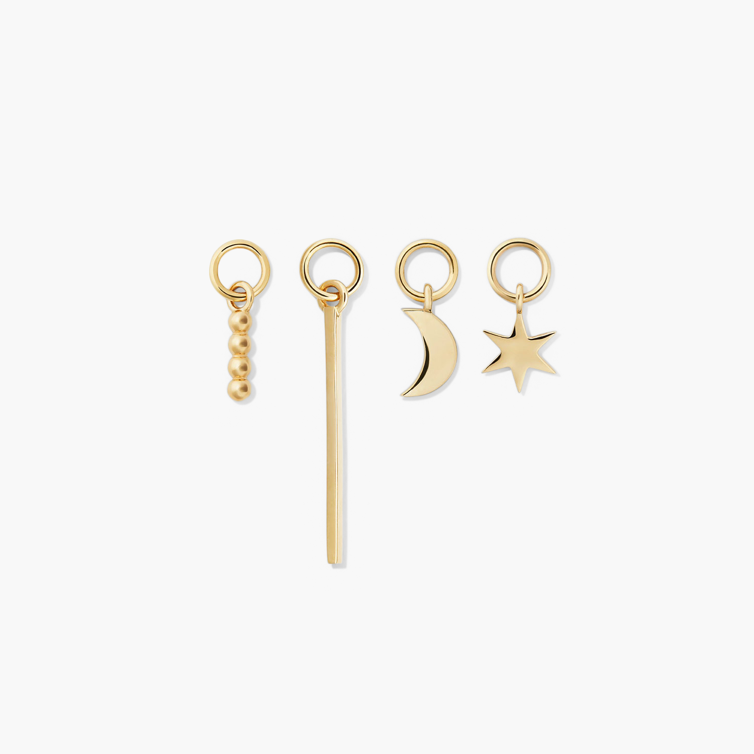 Single Bar Hoop Charm displayed among other gold charms, including rings and a star keychain. Enhance your hoops with this versatile, elegant addition.
