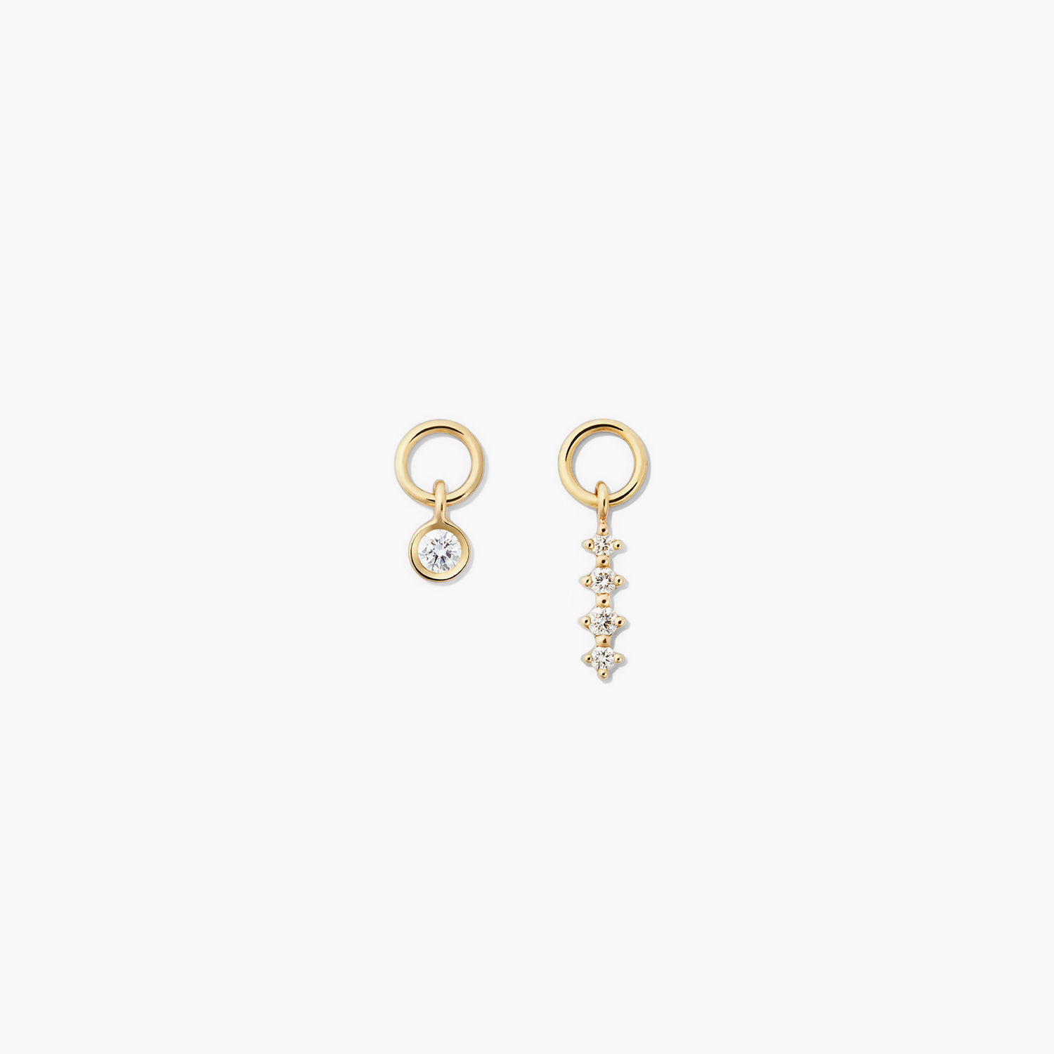 Single Diamond Icicle Hoop Charm: A pair of gold earrings with a diamond accent, ideal for customizing and enhancing everyday hoops with a high-impact look.