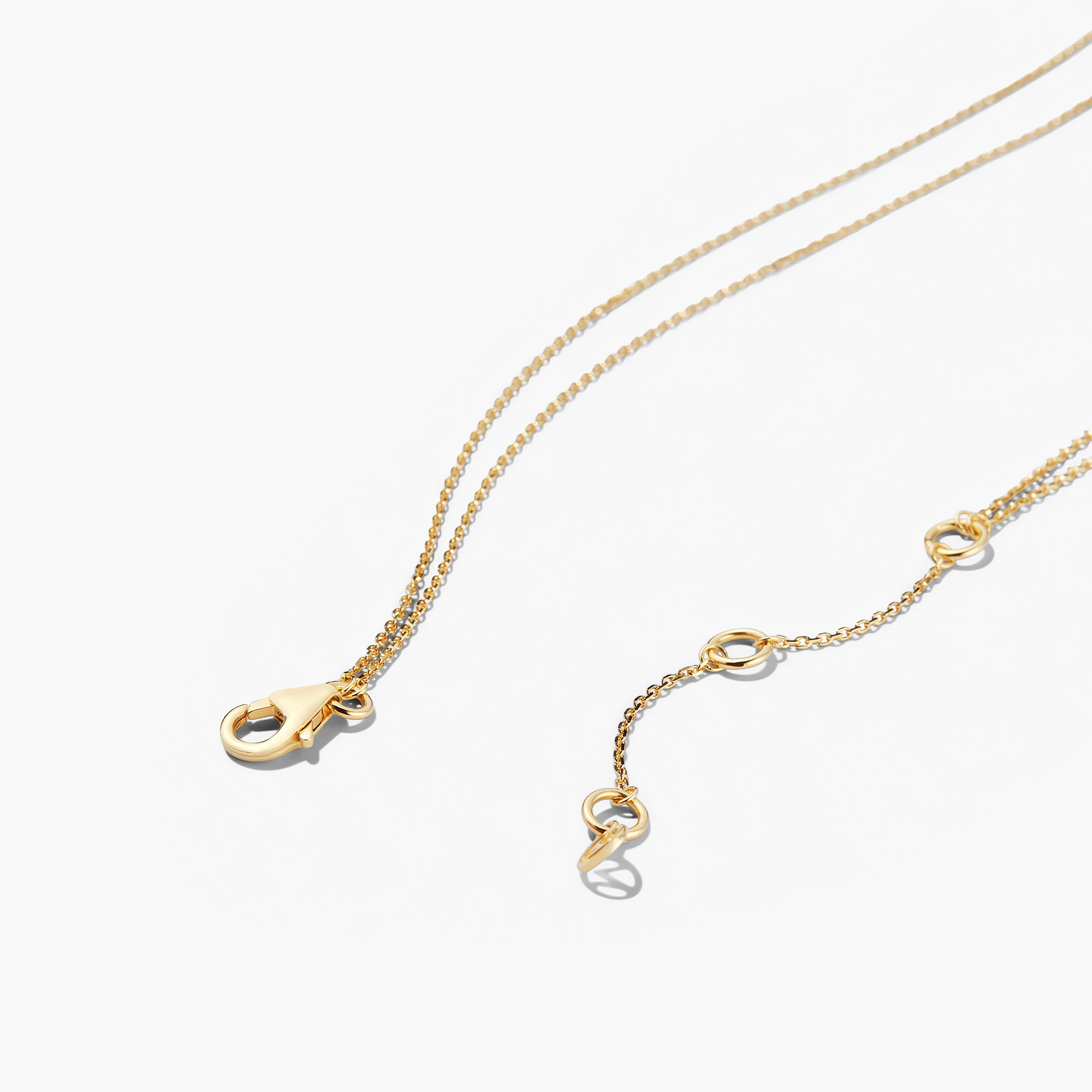 Layered Bar Necklace featuring a gold chain with a central pendant, perfect for adding a touch of elegance to everyday wear.