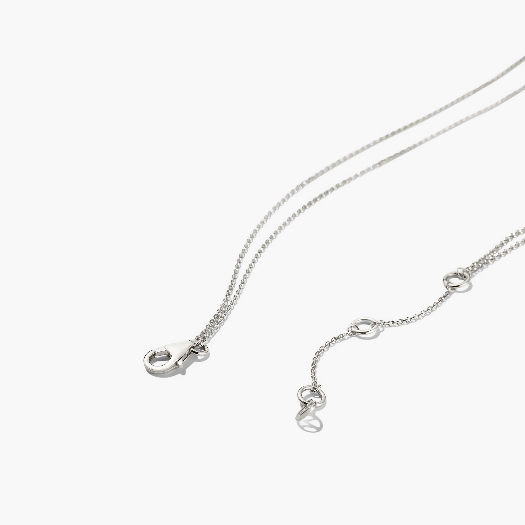 Layered Opal Necklace with two chains and a natural opal pendant, shown in a close-up detail.