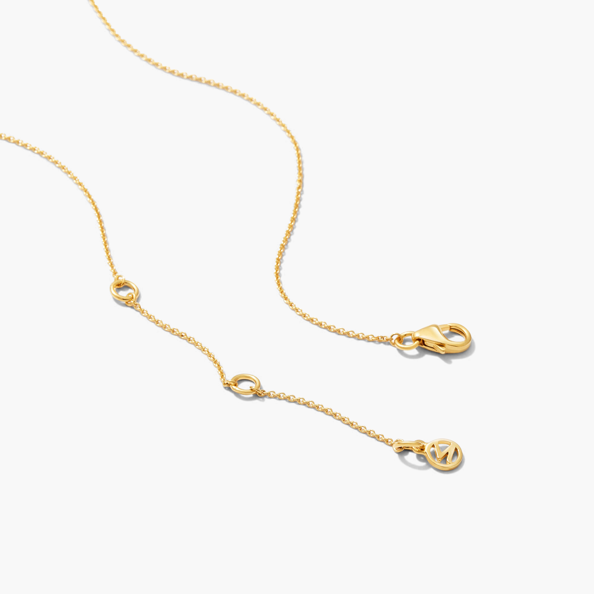 Mini Pearl Pendant Necklace: A close-up of a gold chain with small circles and a letter charm, featuring freshwater pearls handcrafted in 18k gold vermeil.