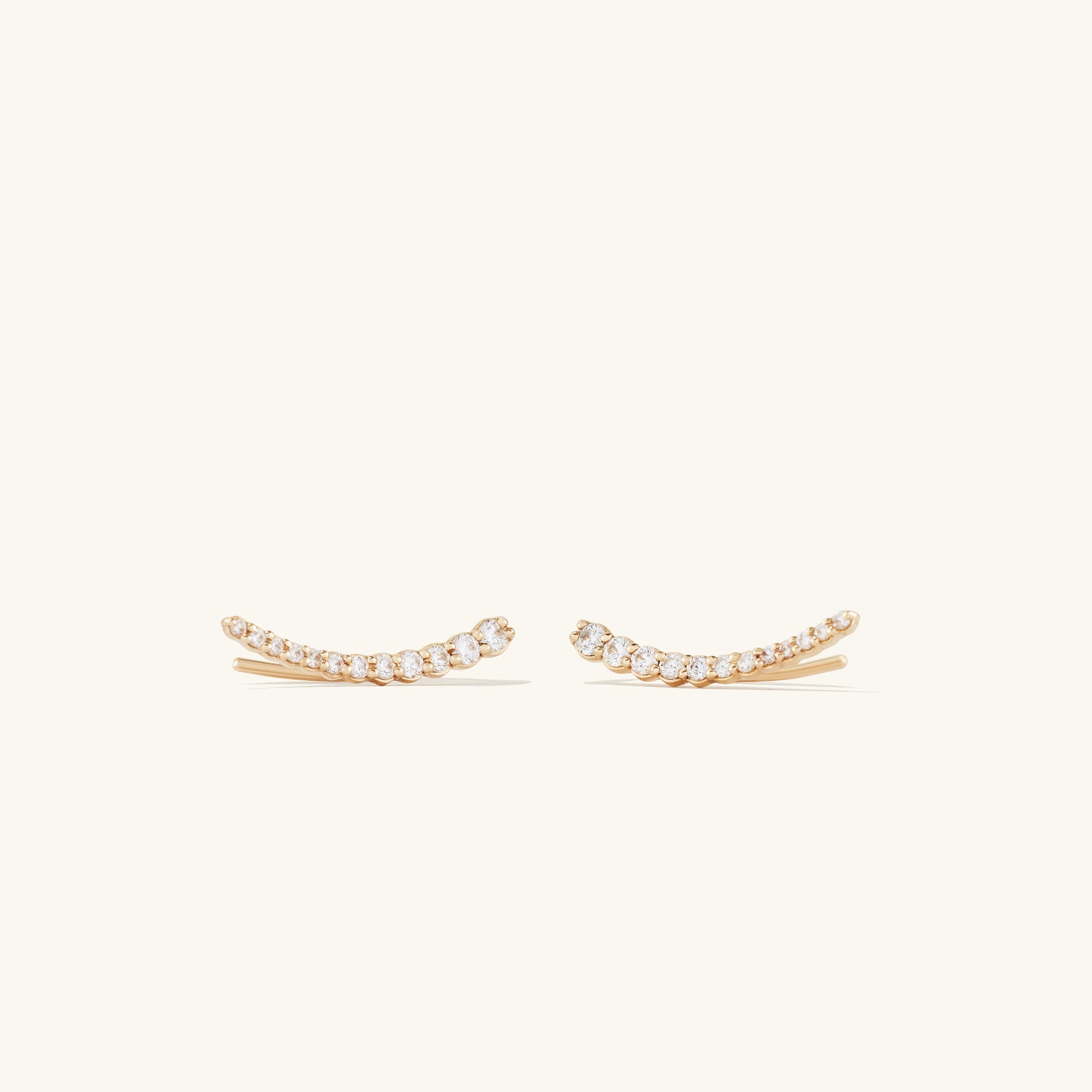 PavÃ© Diamond Climbers: Handcrafted 14k gold earrings featuring pavÃ© diamonds, designed to enhance your ear stack with a shimmering, elegant look.