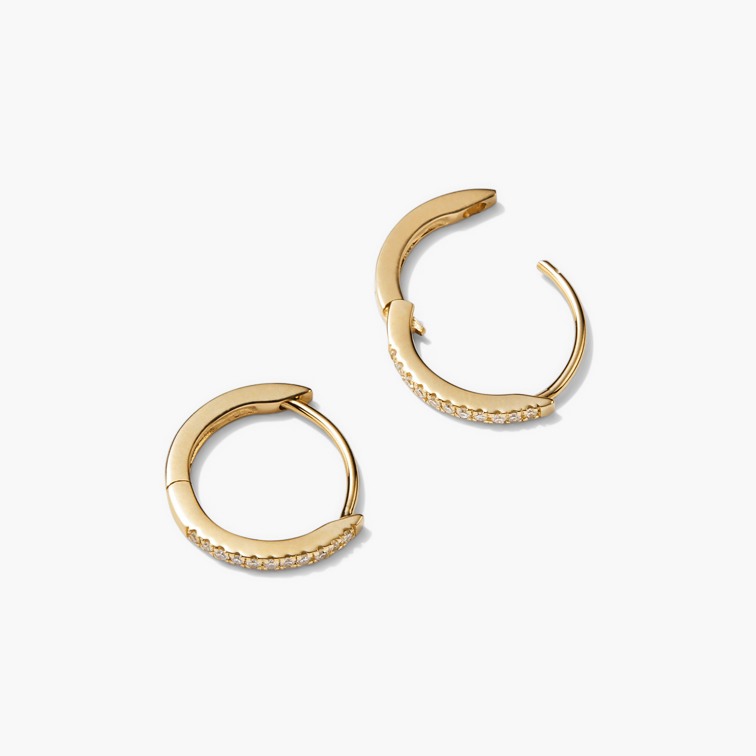 PavÃ© Diamond Huggie Hoops in recycled 14k solid gold, featuring diamonds and a versatile design for stacking or a sleek finish.