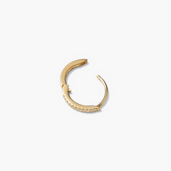 Single PavÃ© Diamond Huggie Hoop in recycled 14k solid gold, featuring diamonds for a versatile, stackable earring designed to elevate any outfit.