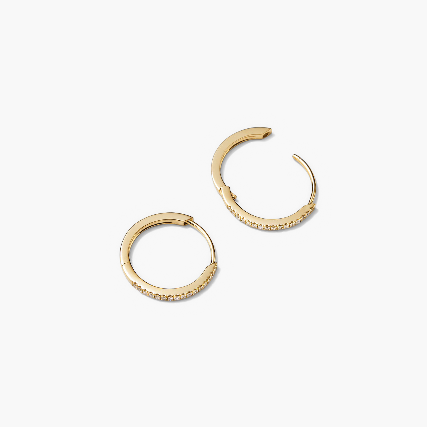 PavÃ© Diamond Small Hoops: A pair of handcrafted 14k solid gold hoop earrings, featuring pavÃ© diamonds, designed for versatile wear.