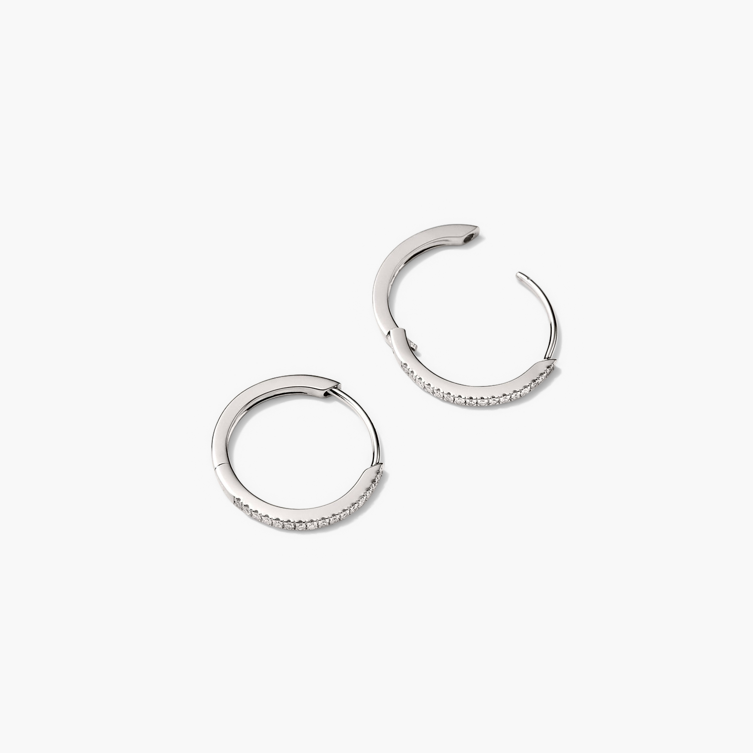 PavÃ© Diamond Small Hoops: A pair of silver hoop earrings featuring pavÃ© diamonds, handcrafted in recycled 14k solid gold, designed for versatile wear.
