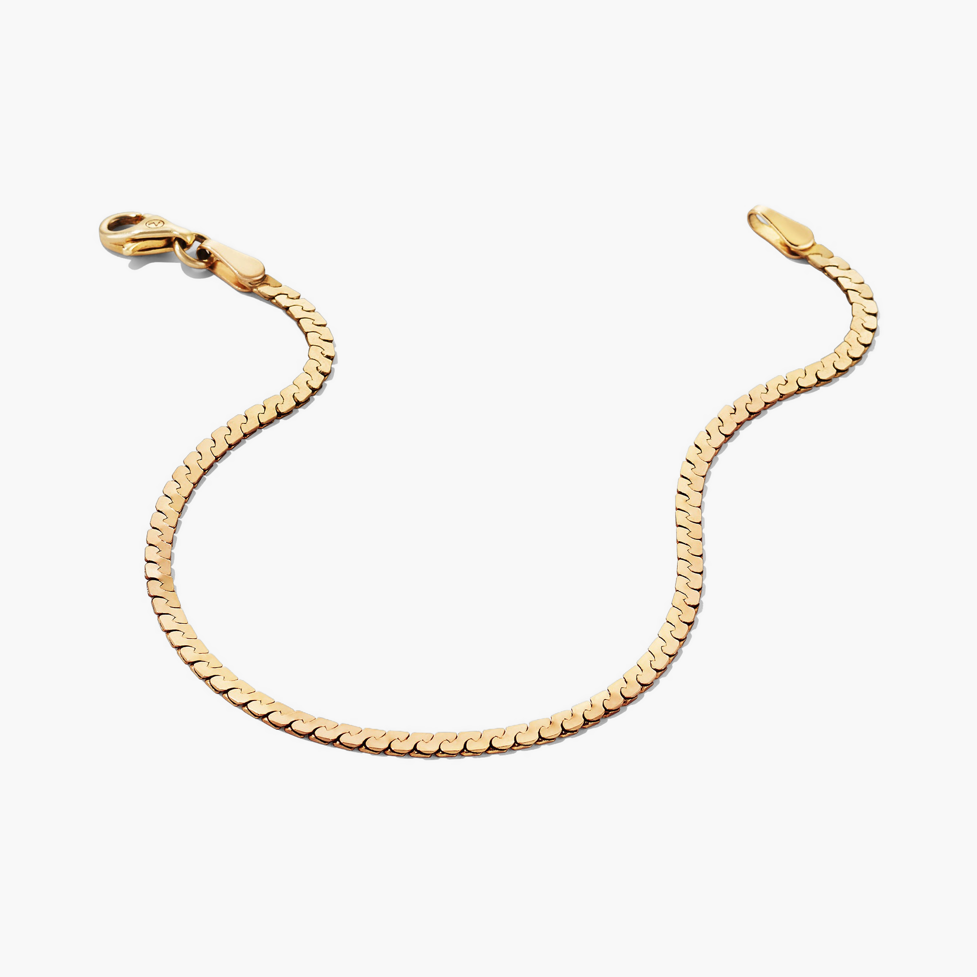 Serpentine Chain Bracelet with flat, braided links and clasp, designed for sleek, comfortable all-day wear.