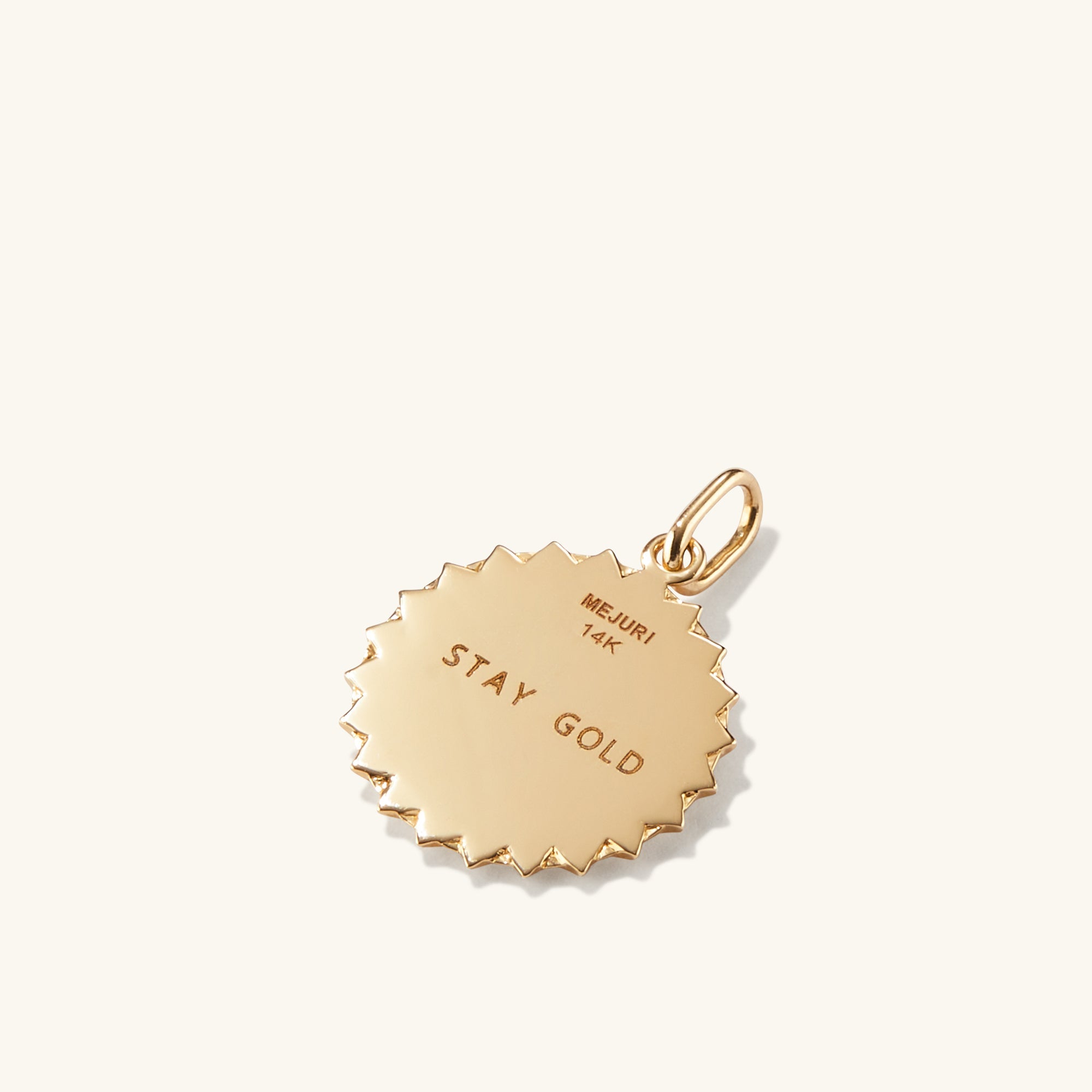 Strength: Rose Coin Charm Pendant - Close-up of a gold medallion with engraved text, symbolizing strength, handcrafted in recycled 14k solid gold.