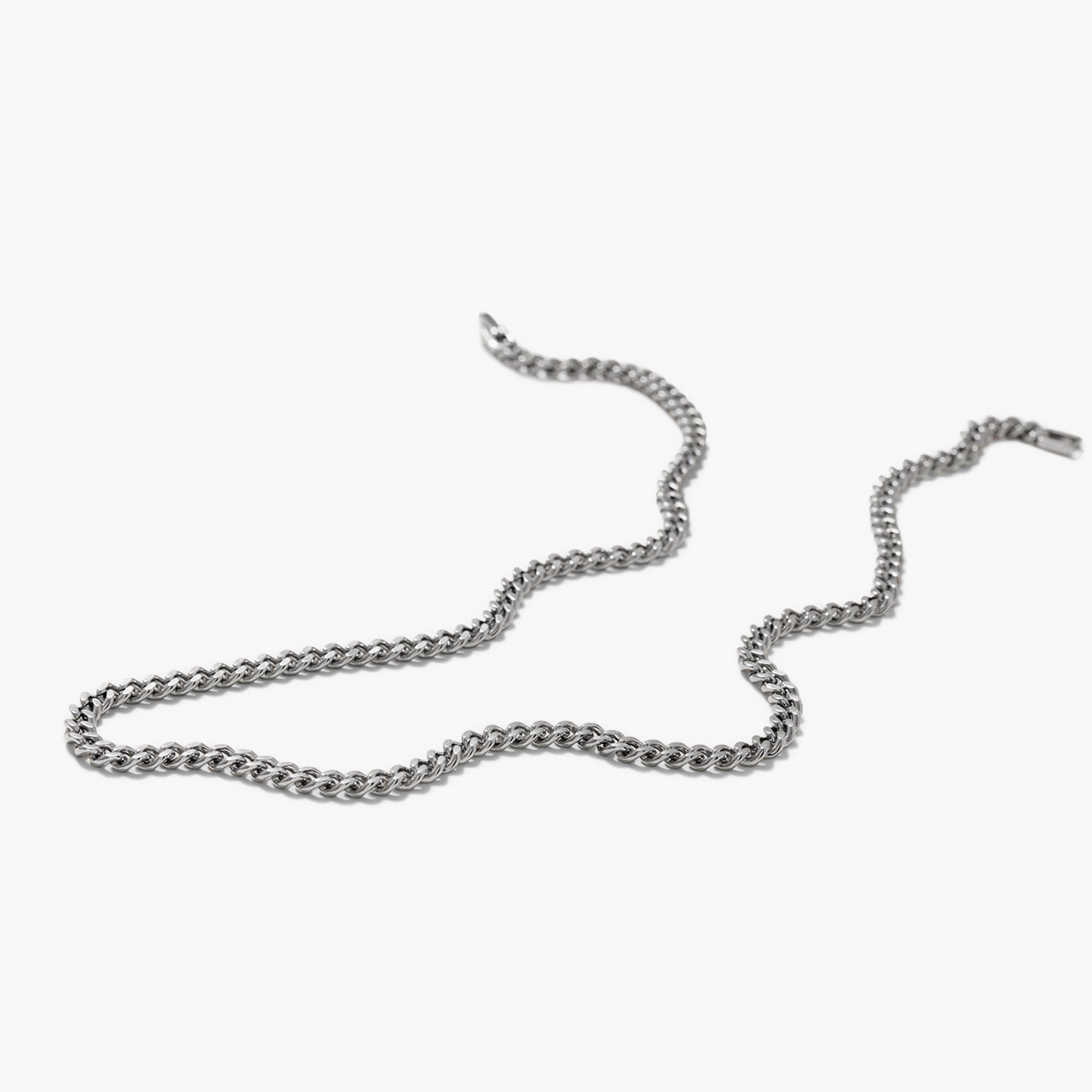5mm Curb Chain Necklace, a close-up of a silver chain. Ideal for everyday wear, can be worn solo or layered for a statement look.