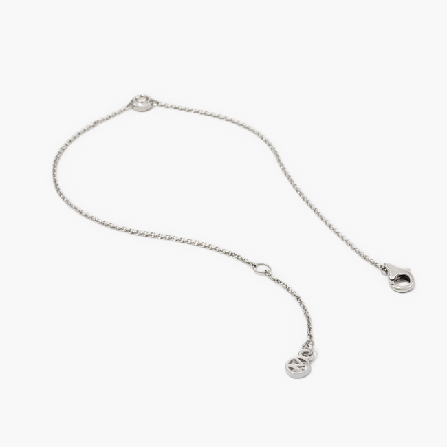 Solo Diamond Bracelet: A solid gold bracelet featuring a round cut diamond in a bezel setting, embodying timeless elegance and lasting value.