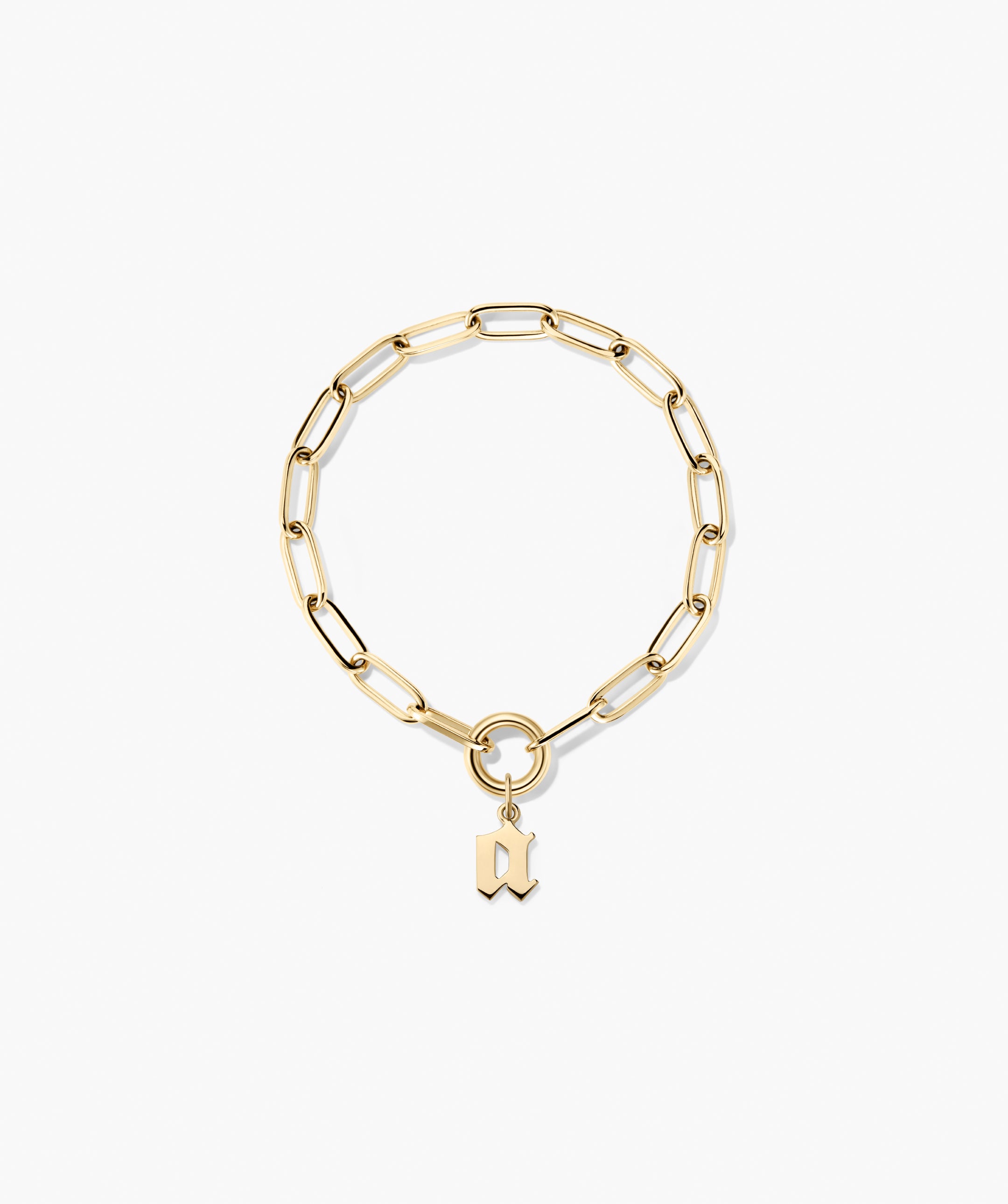 Gothic Letter Pendant: Chunky gold-tone chain with paperclip links, front toggle-ring clasp, and Old English style letter pendant adds edgy charm.