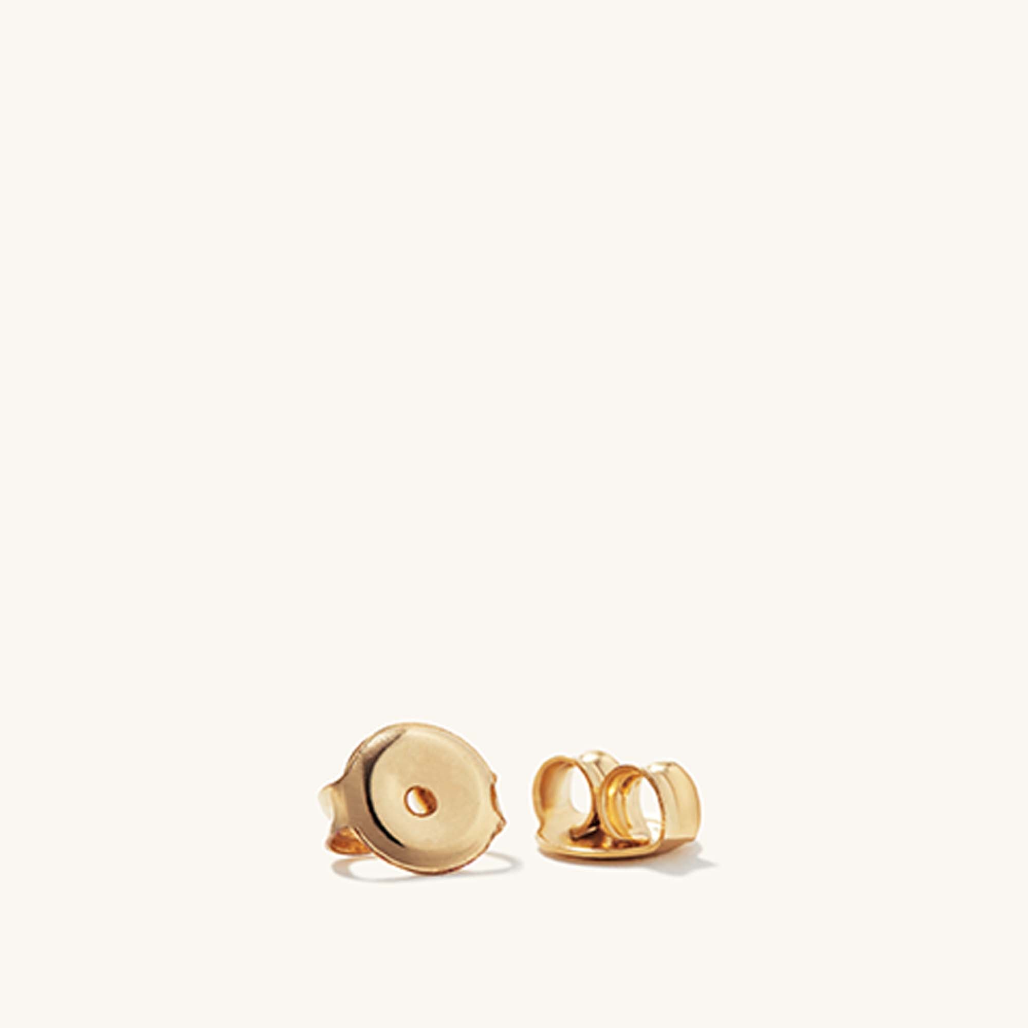 Charlotte Bold Hoops: A pair of intricately designed gold earrings inspired by French desserts, perfect for adding a sweet touch to your accessory collection.