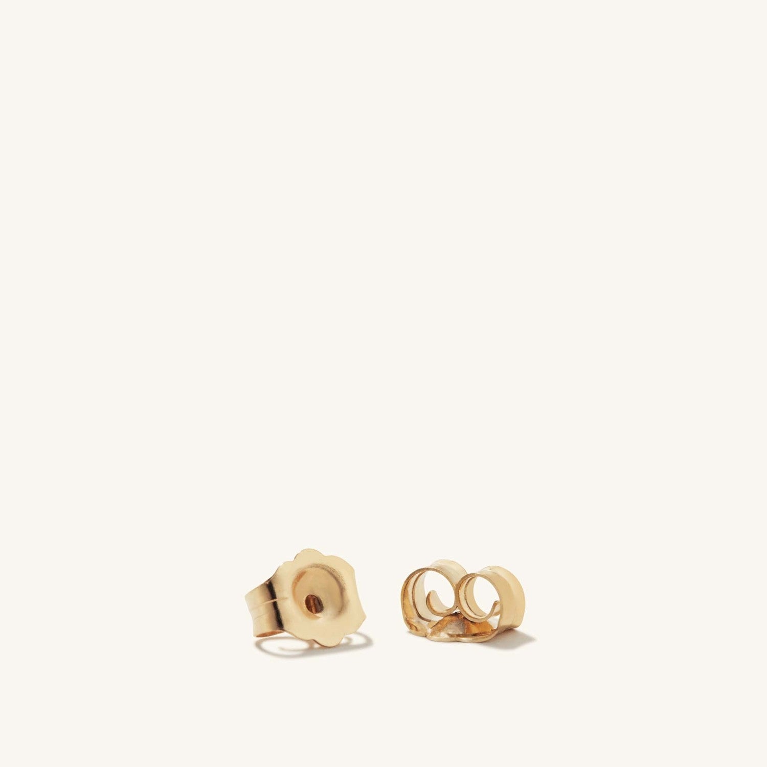 Diamond Pearl Studs: Handcrafted 14k gold earrings featuring a single diamond and a pearl, offering a timeless, elegant design perfect for any occasion.