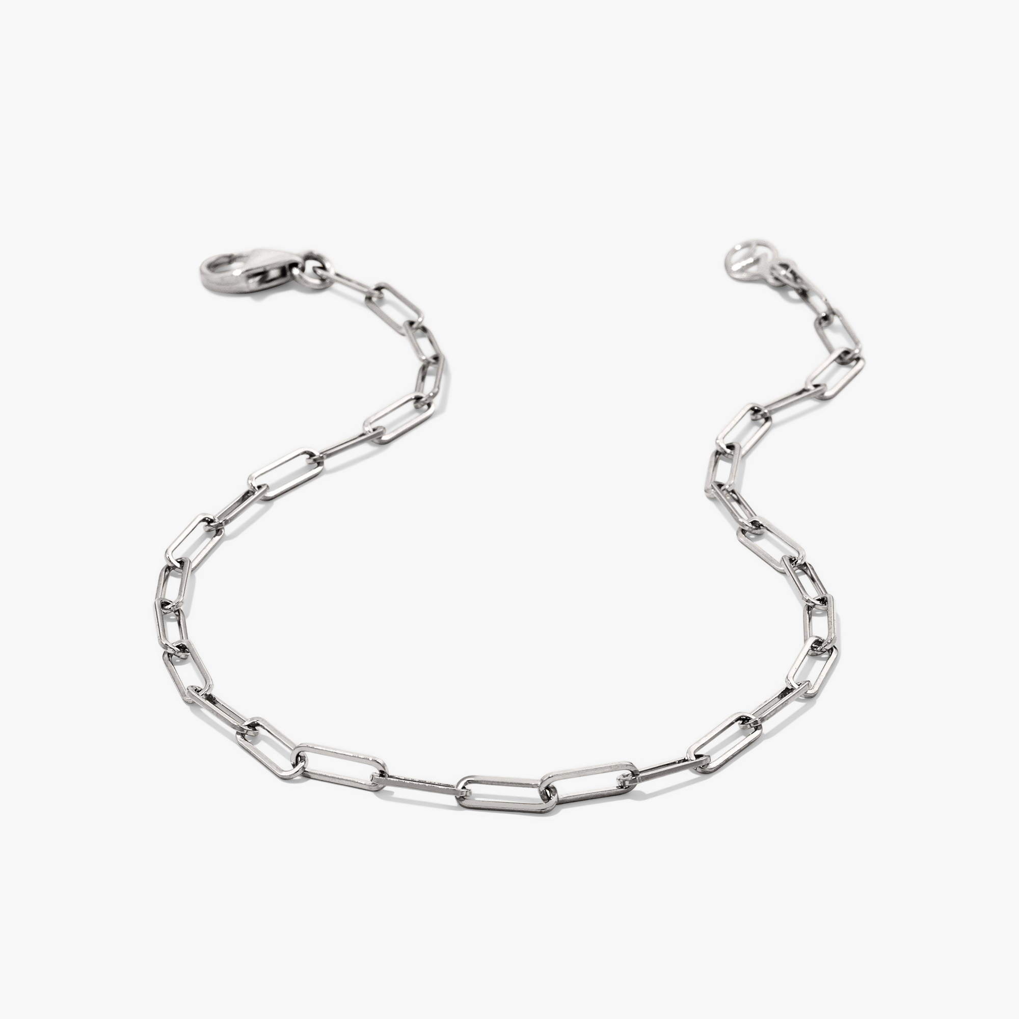 Boyfriend Bold Bracelet: A silver chain bracelet with a clip, designed to complement casual, raw denim styles, perfect for everyday wear.